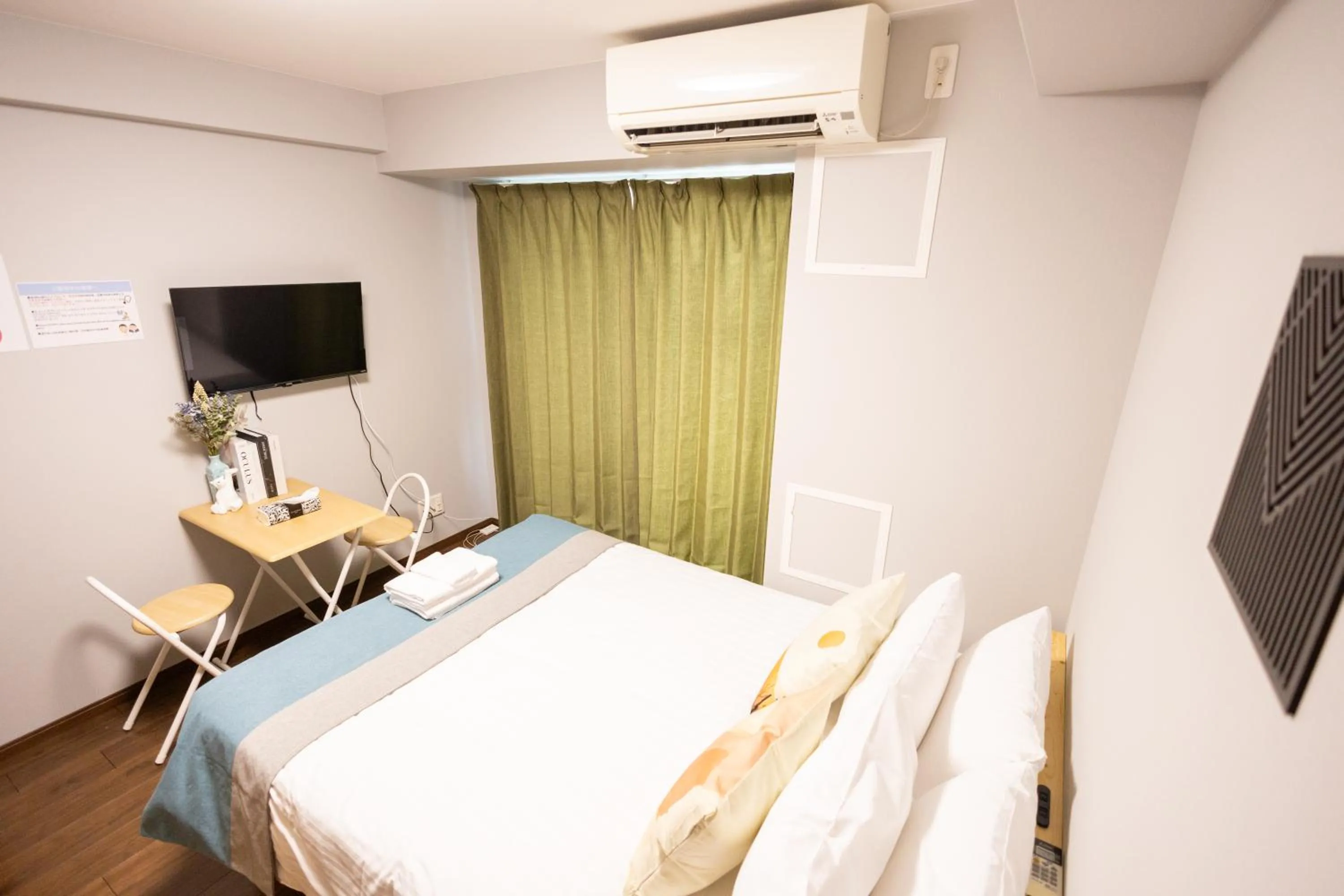 Bed in nestay apartment osaka ebisu