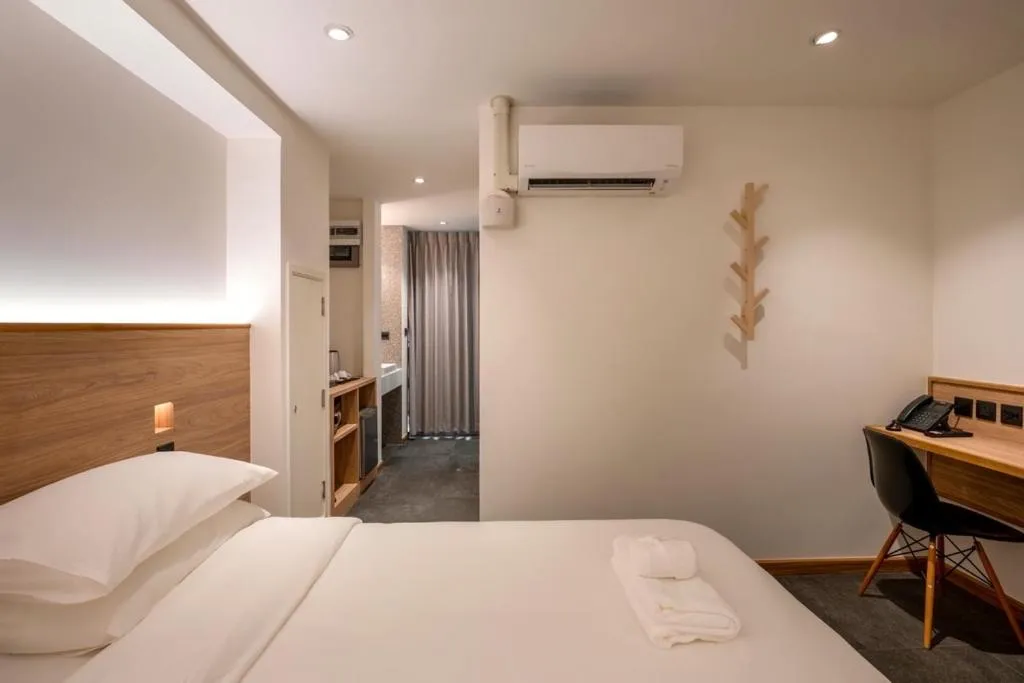 Bed in ZEN MASTER HOTEL