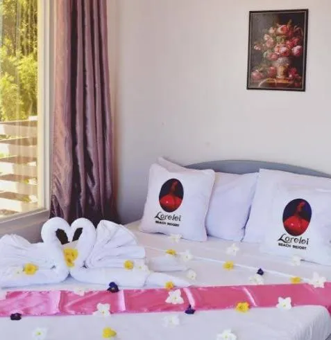 Bed in LORELEI BEACH RESORT