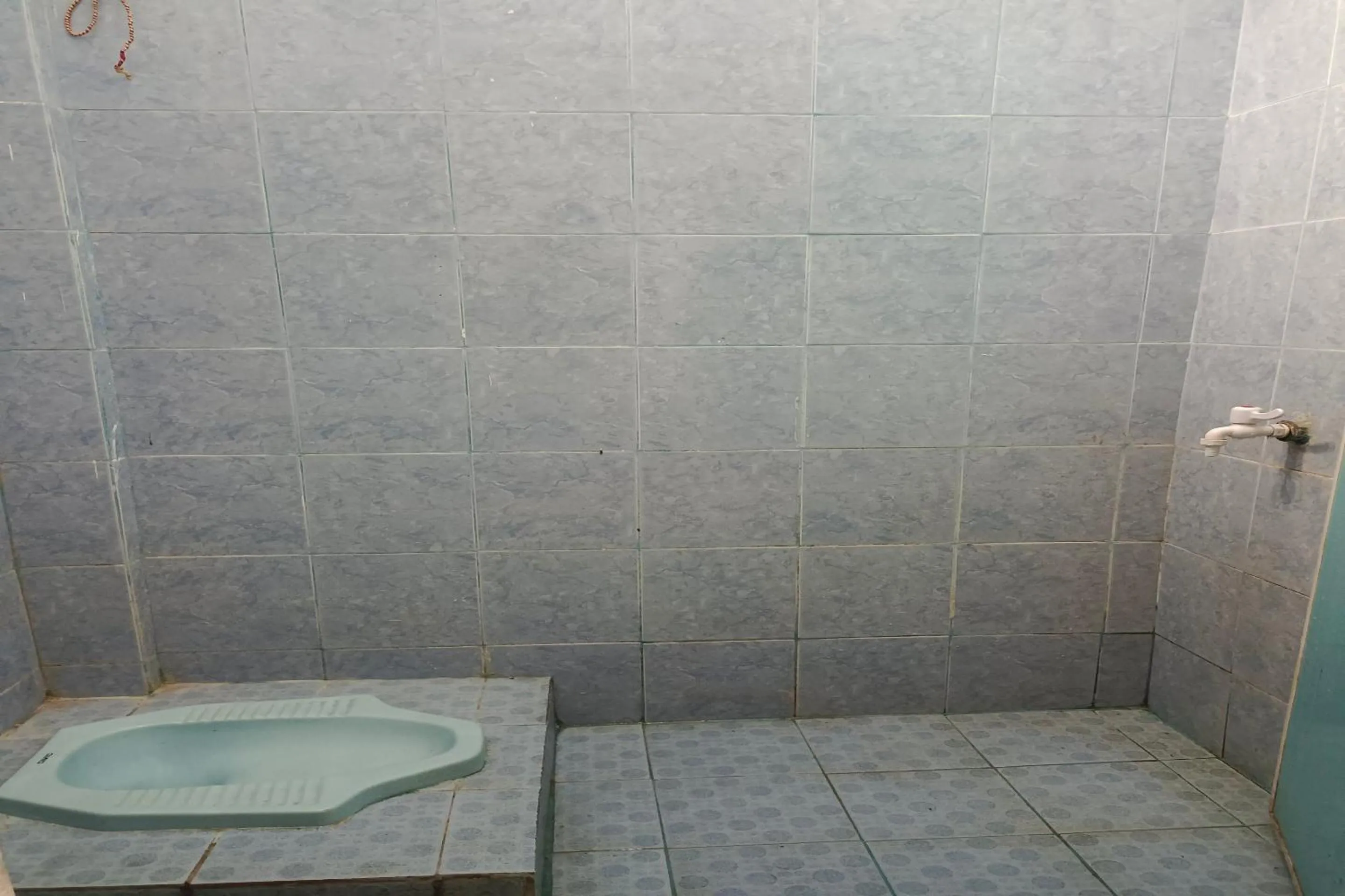 Bathroom in Hotel O Elang Homestay