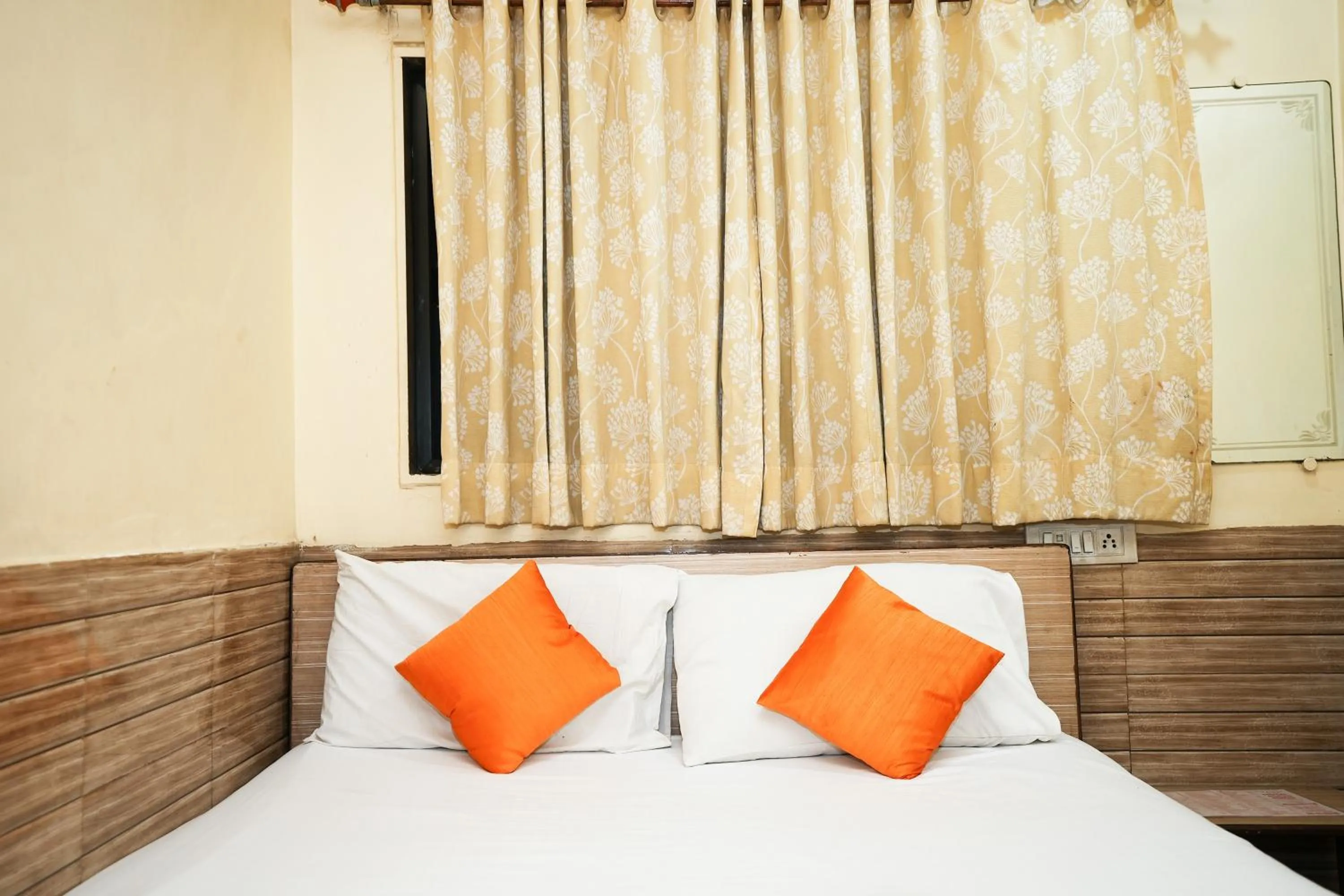 Bed in Hotel Sai Parikrama