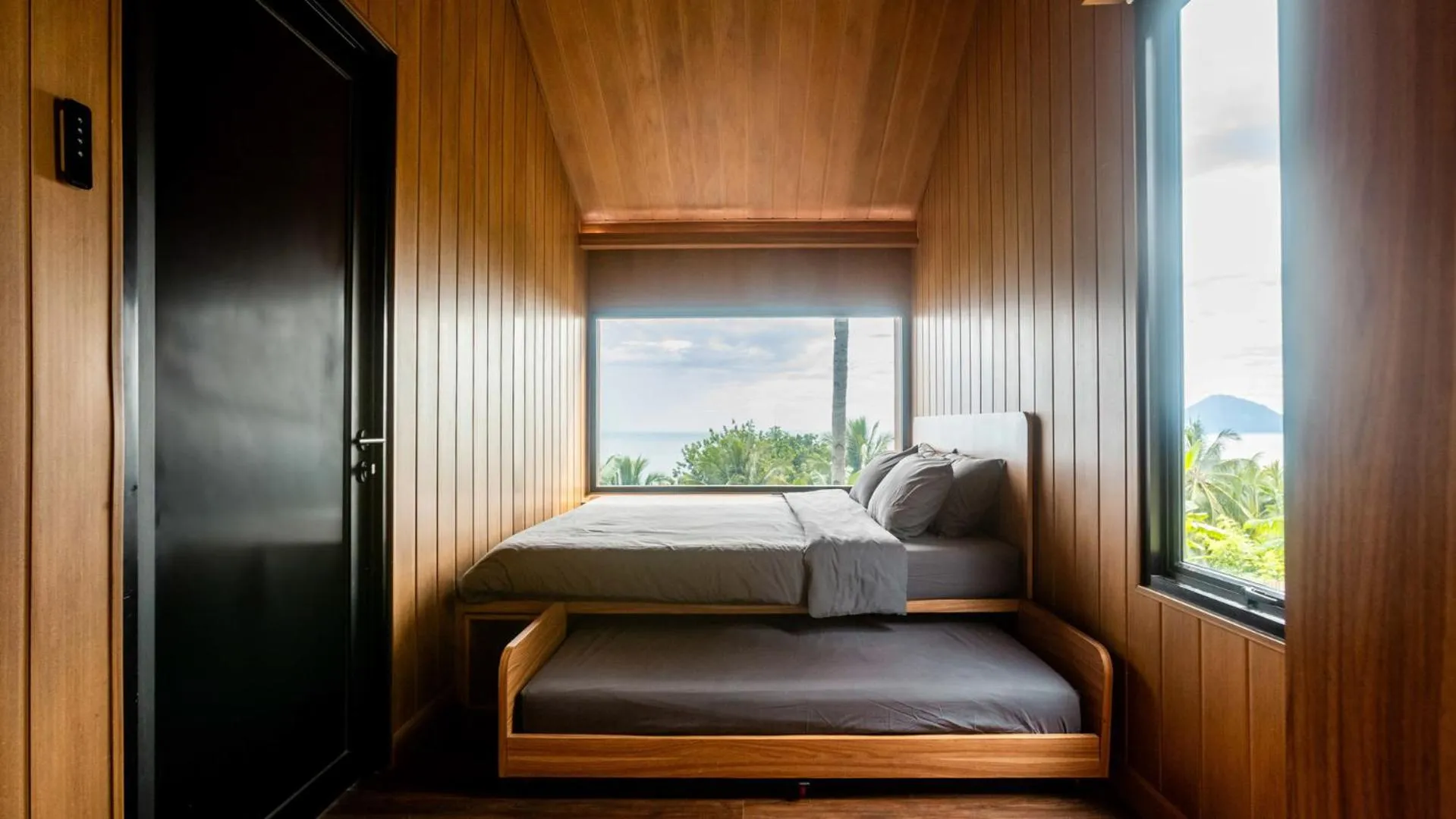 Bed in Bobocabin Bunaken Hills, Manado