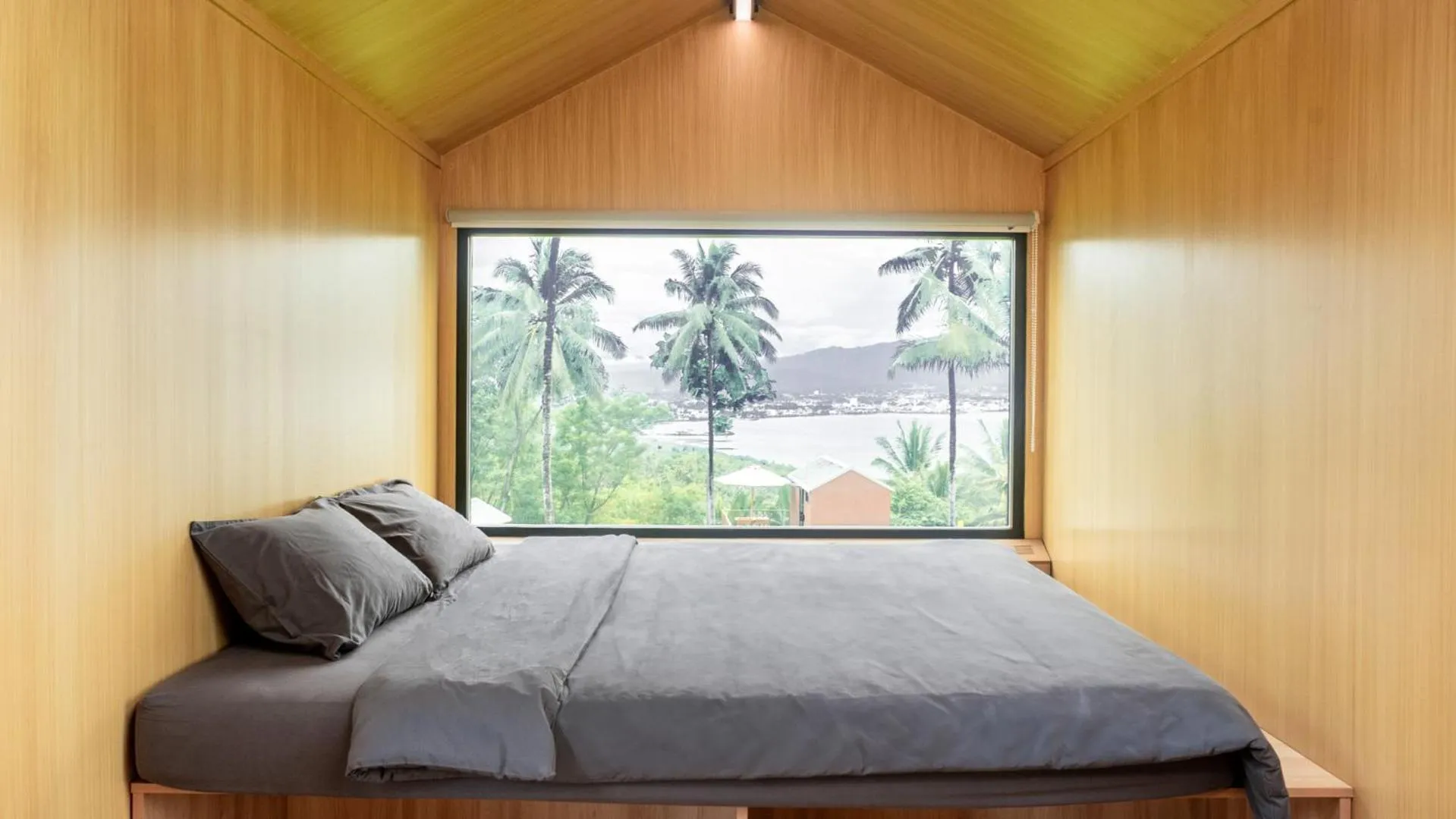 Bed in Bobocabin Bunaken Hills, Manado