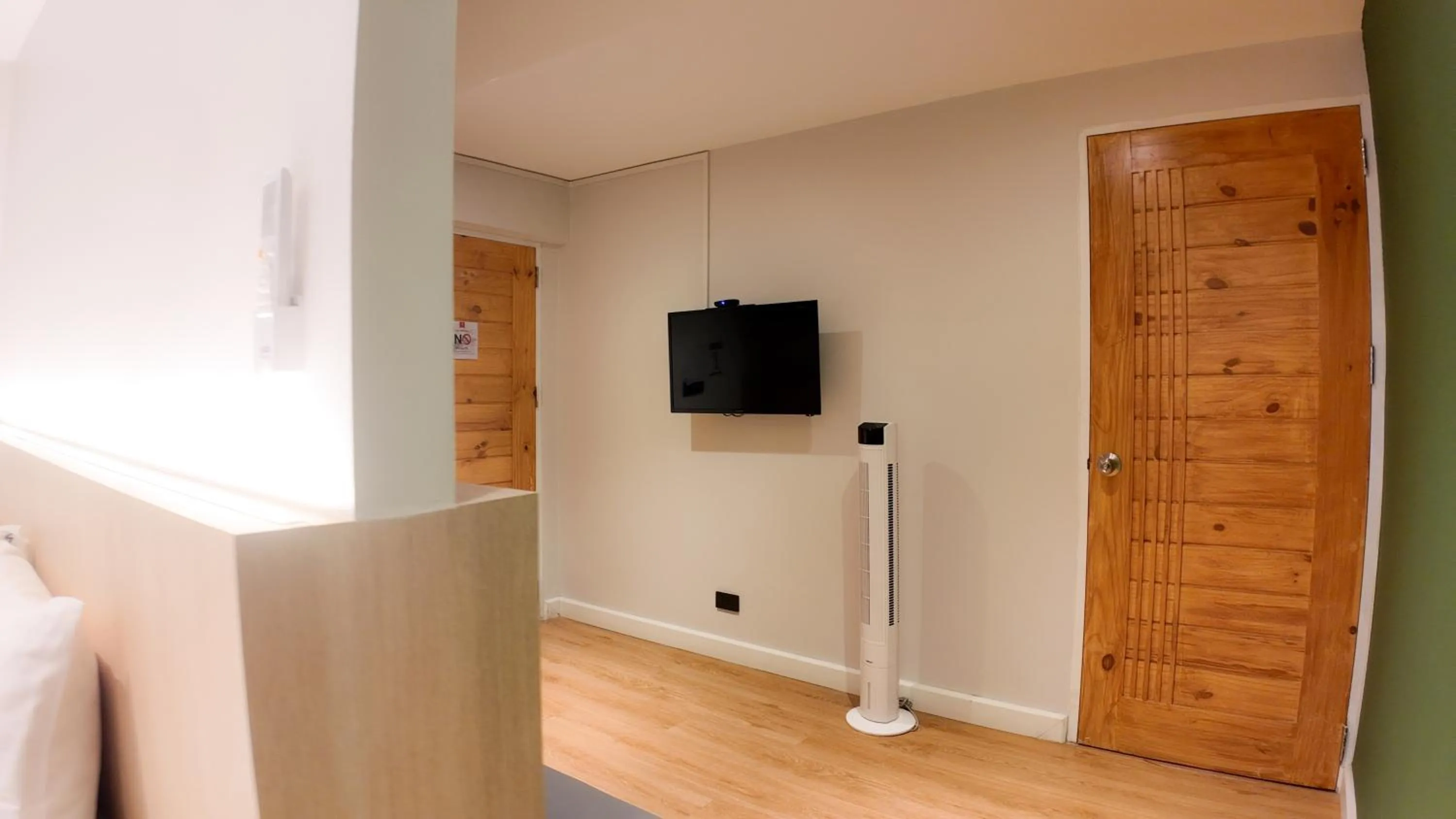 Communal lounge/ TV room in V1 boutique hotel