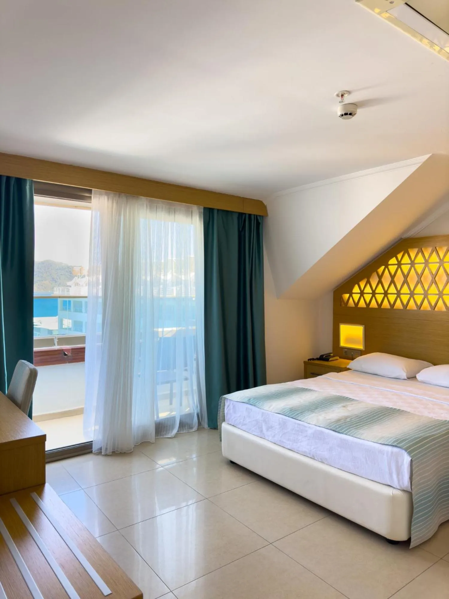 Bed in Aurasia Design Hotel