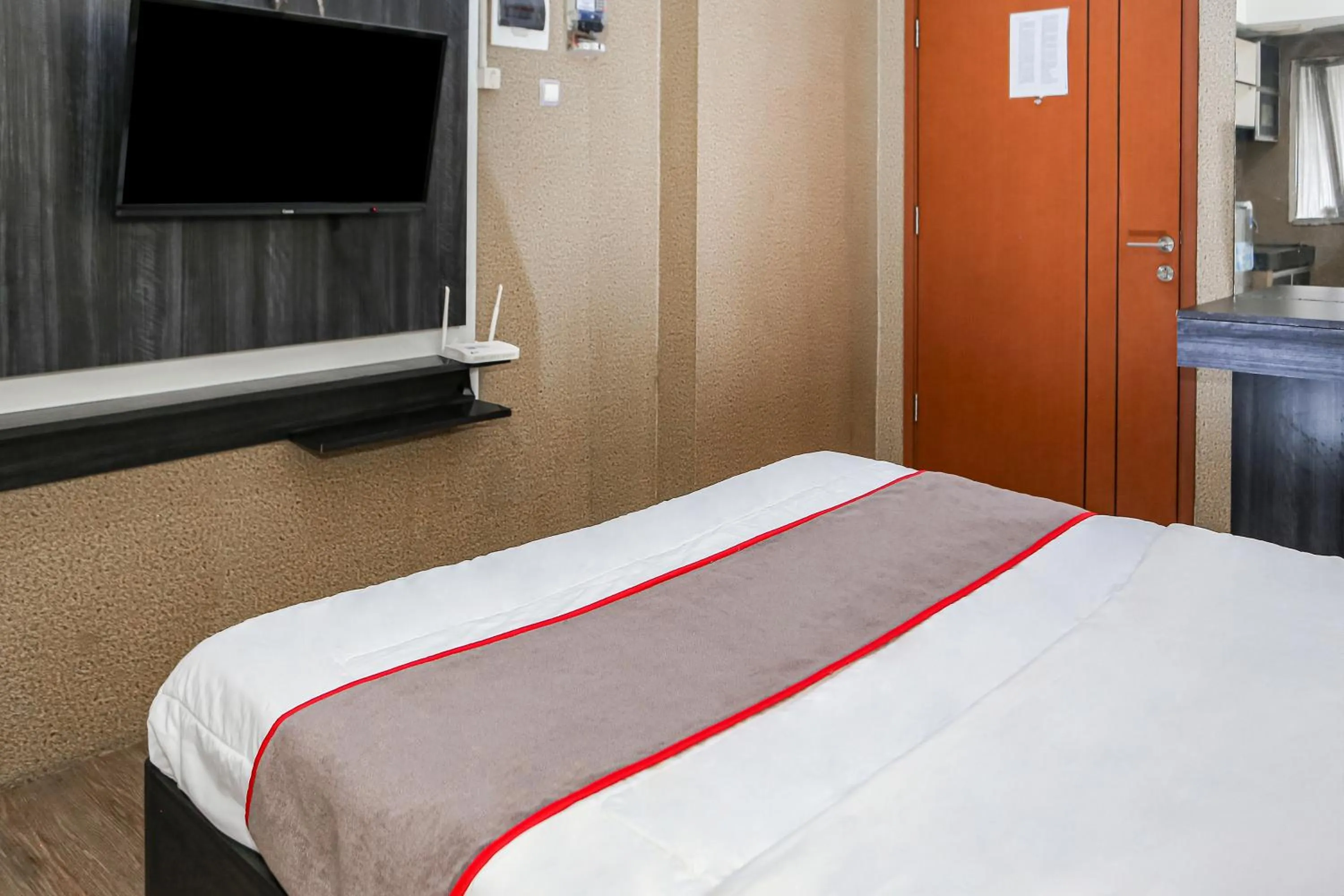 Bedroom in Capital O 93372 Aurora Residence