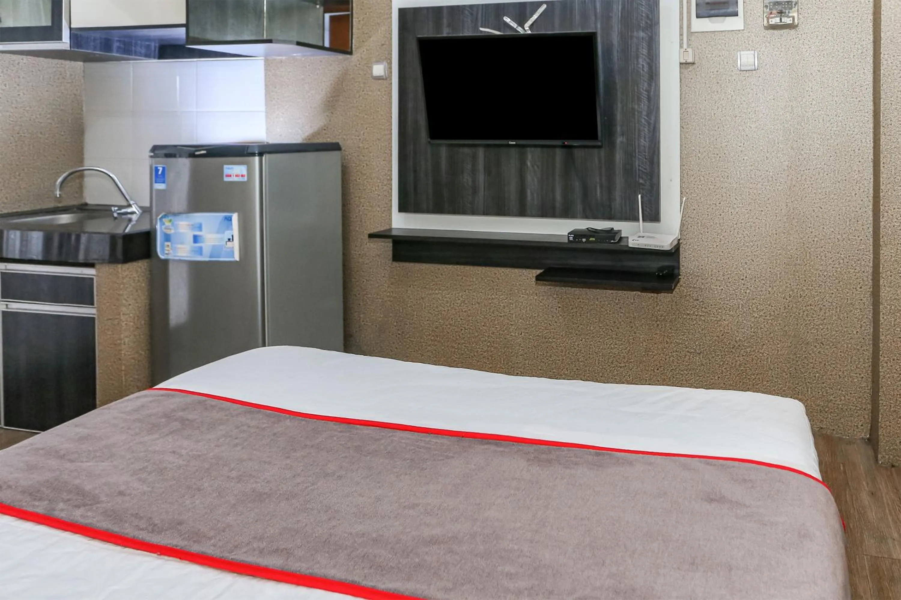 Bedroom in Capital O 93372 Aurora Residence