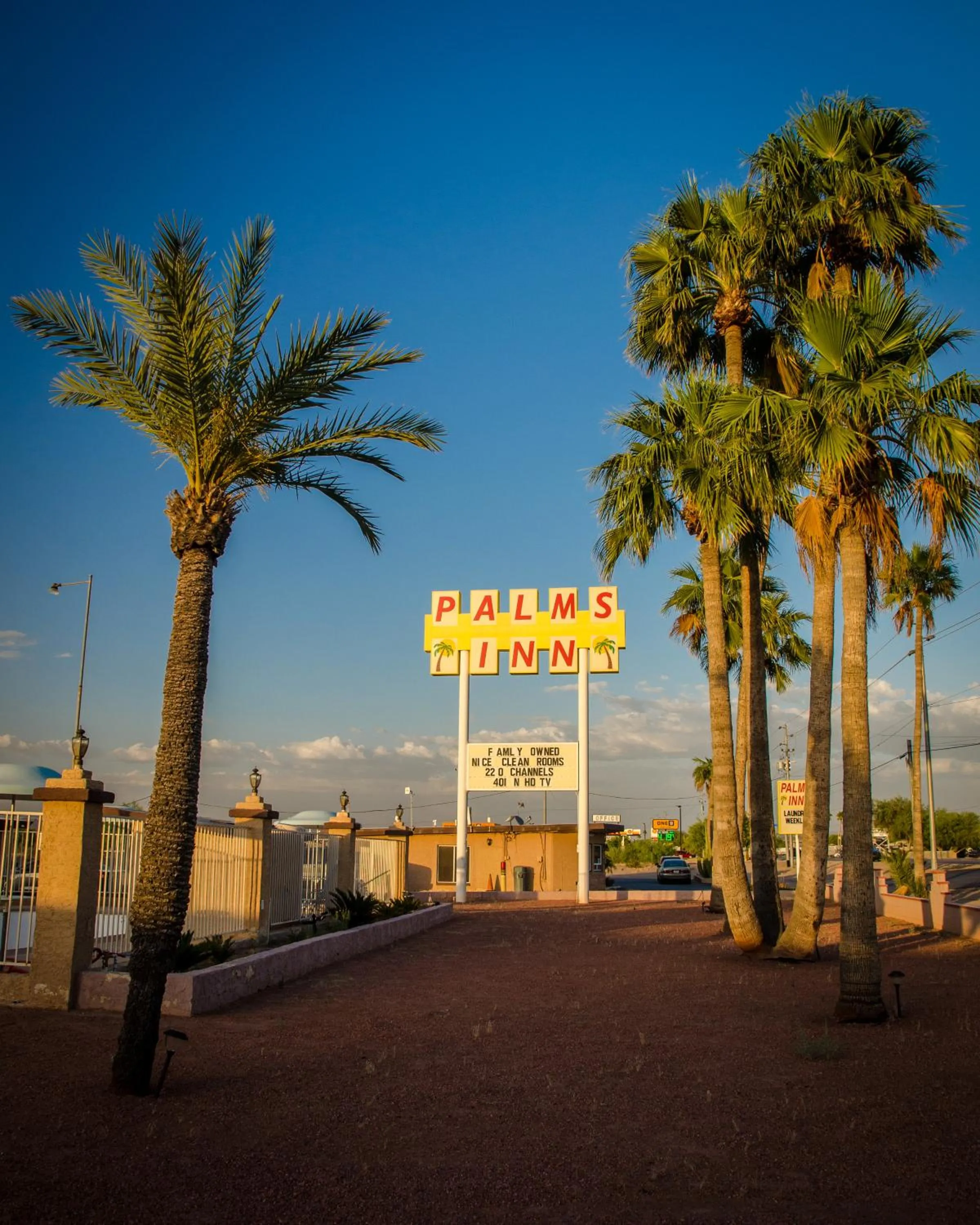 Property logo or sign in Palms Inn