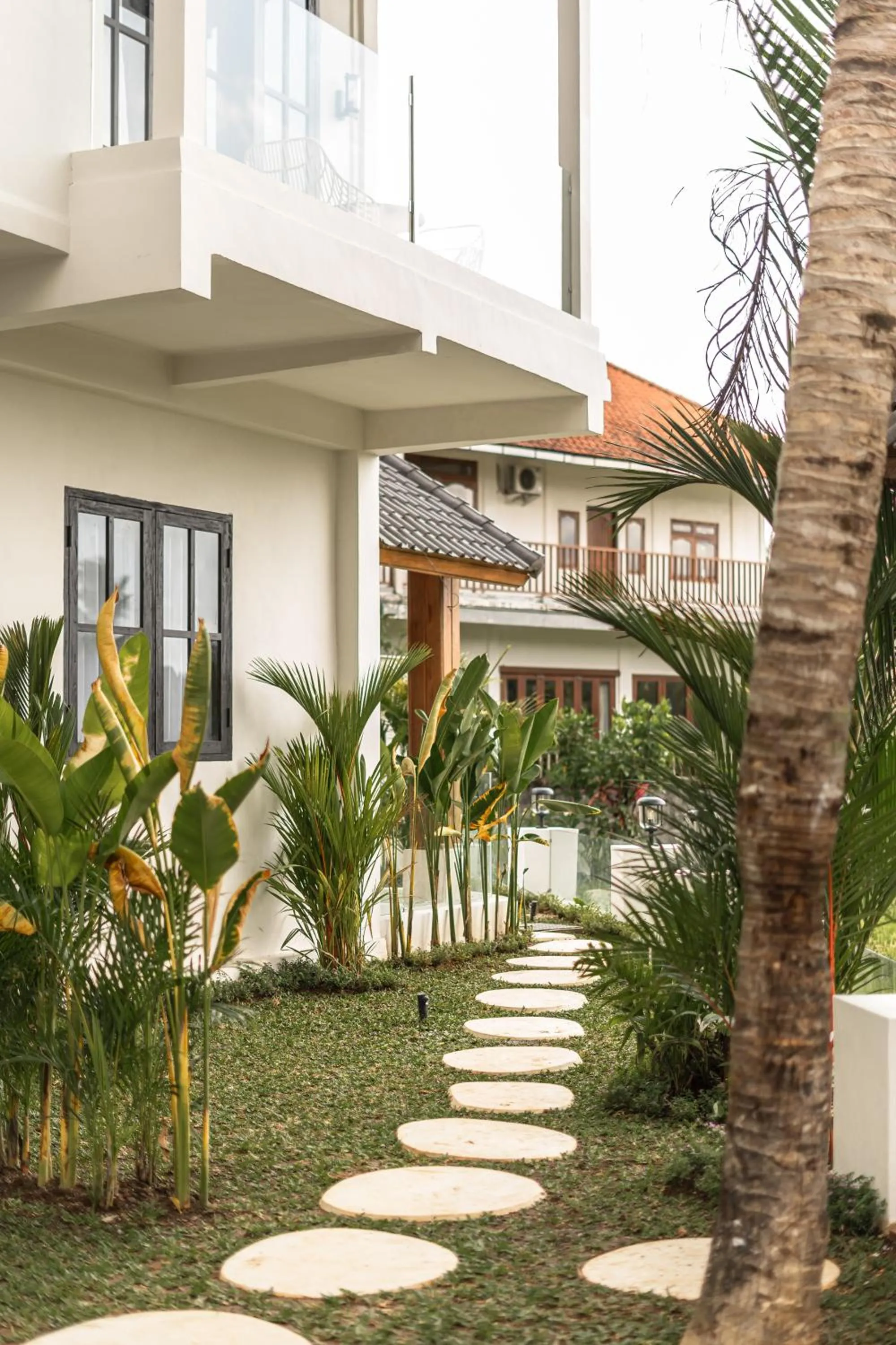 Property building in Sarang Apartments by EVDEkimi - Rice field escape with Yoga lounge, Lush garden - Long stay extras