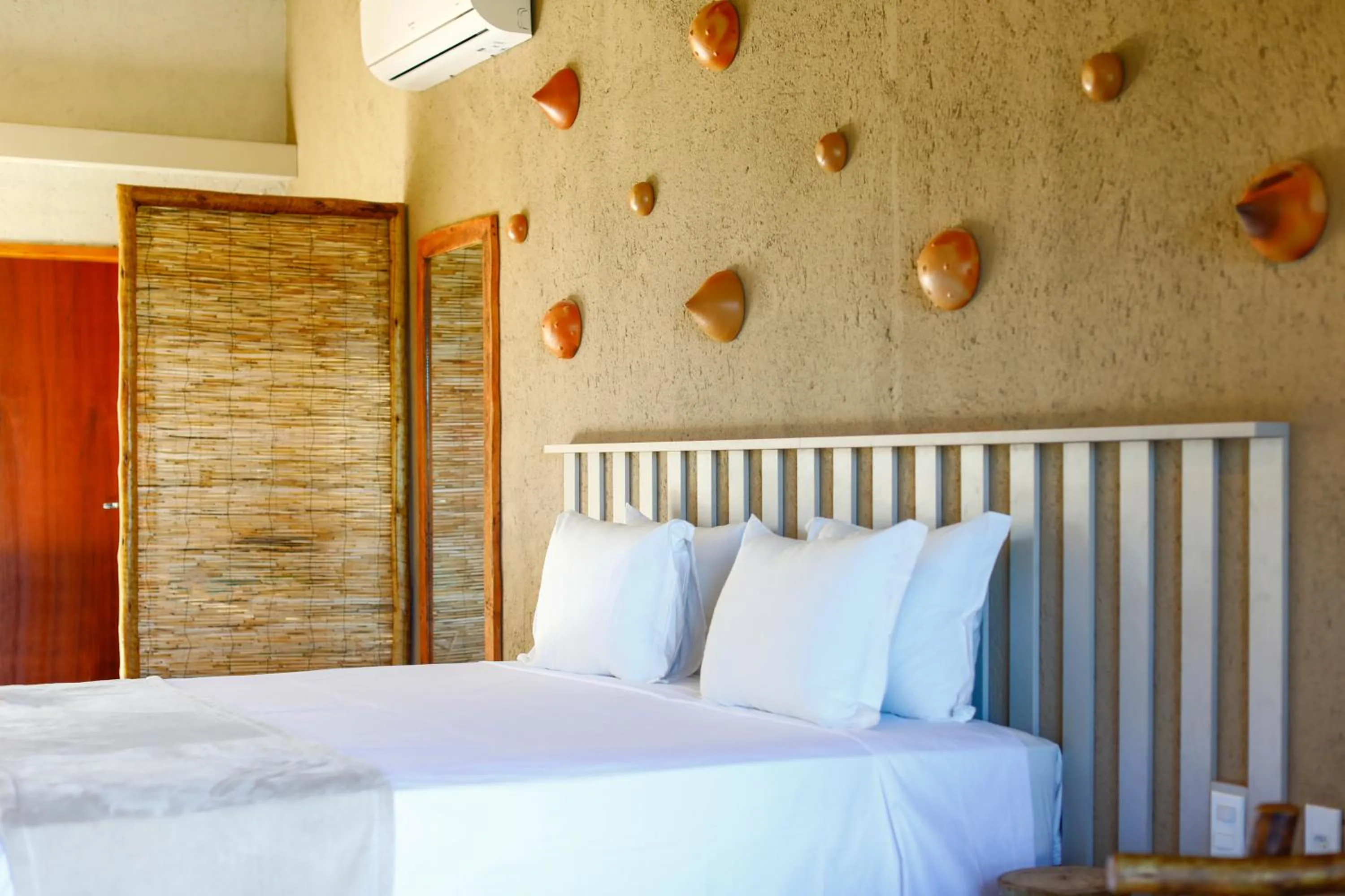 Bed in MONAN BOUTIQUE HOTEL