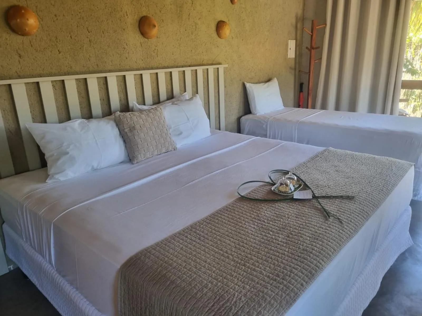 Bed in MONAN BOUTIQUE HOTEL