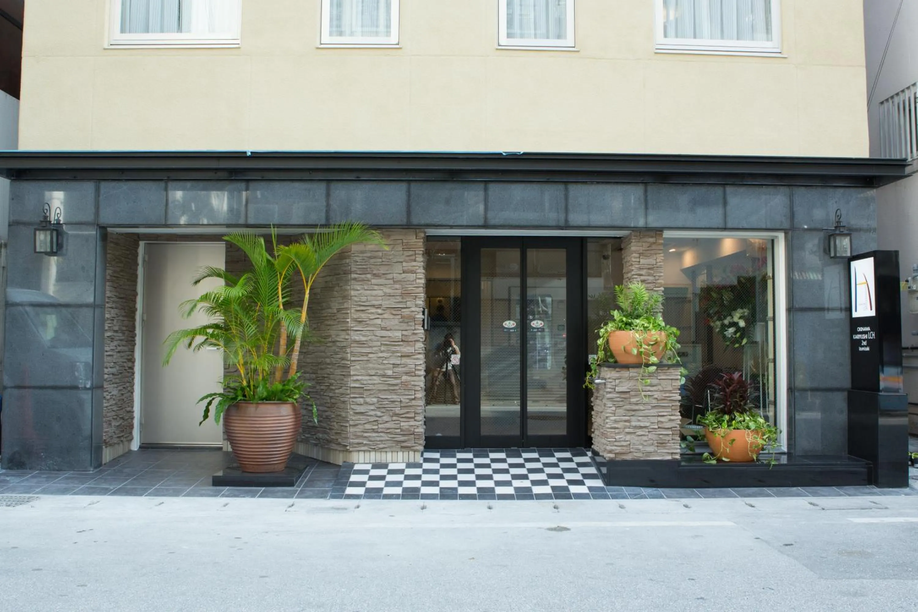 Facade/entrance in Kariyushi LCH. Izumizaki Kencho Mae