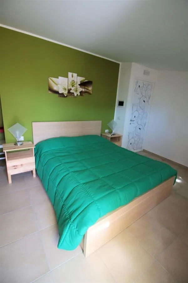 Bed in La Rosatea Rooms