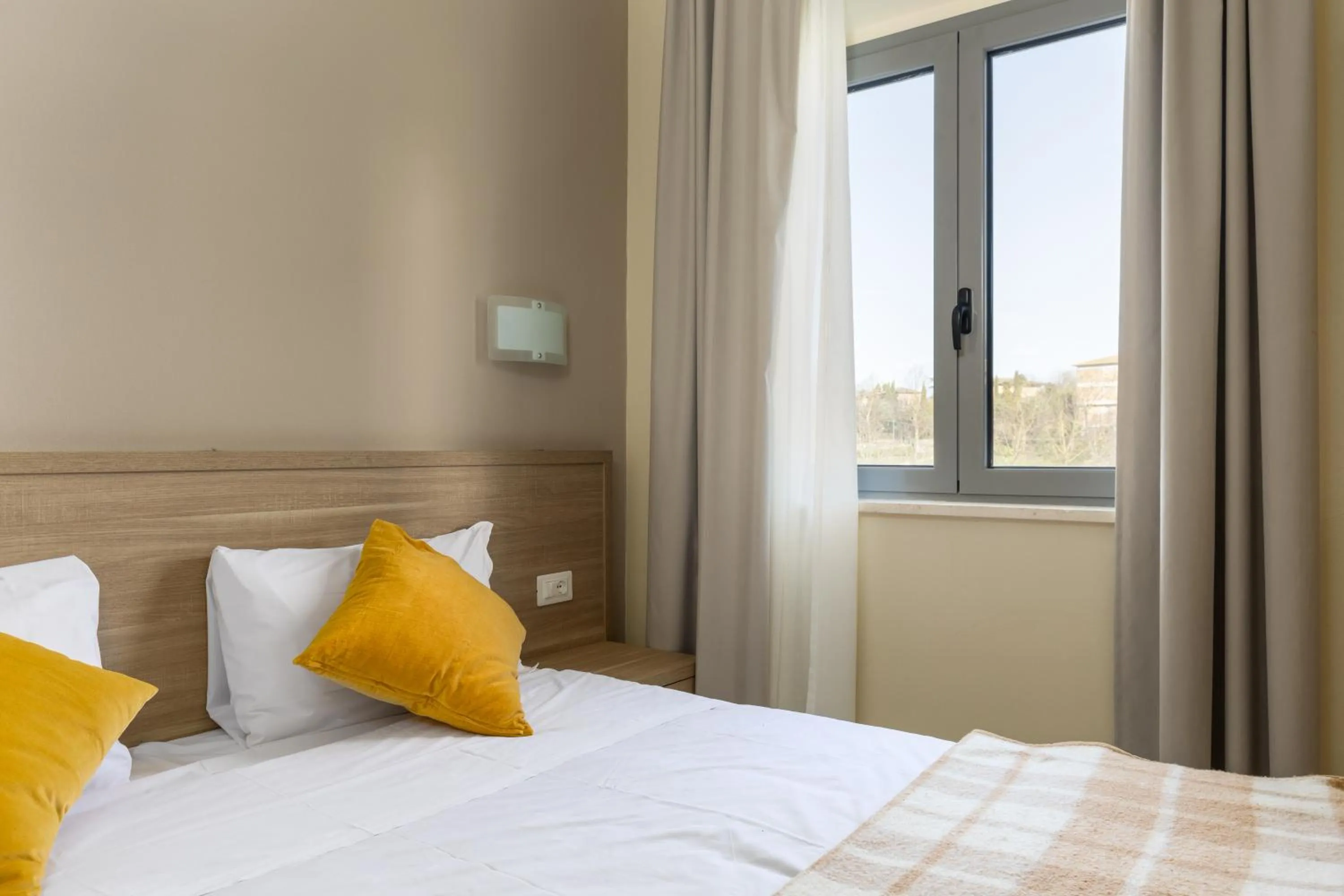 Bed in Tuscasì Aparthotel