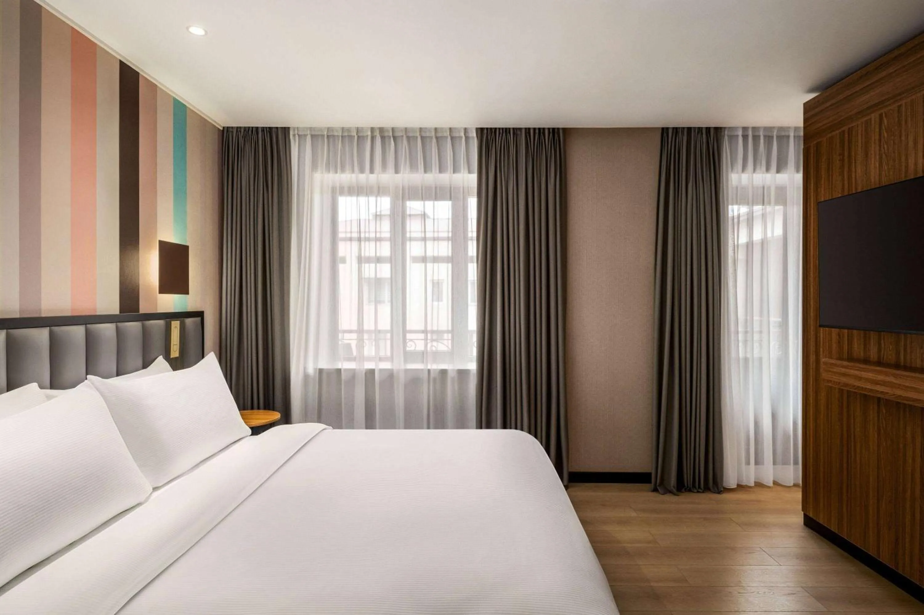 Bed in Ramada Encore by Wyndham Tashkent