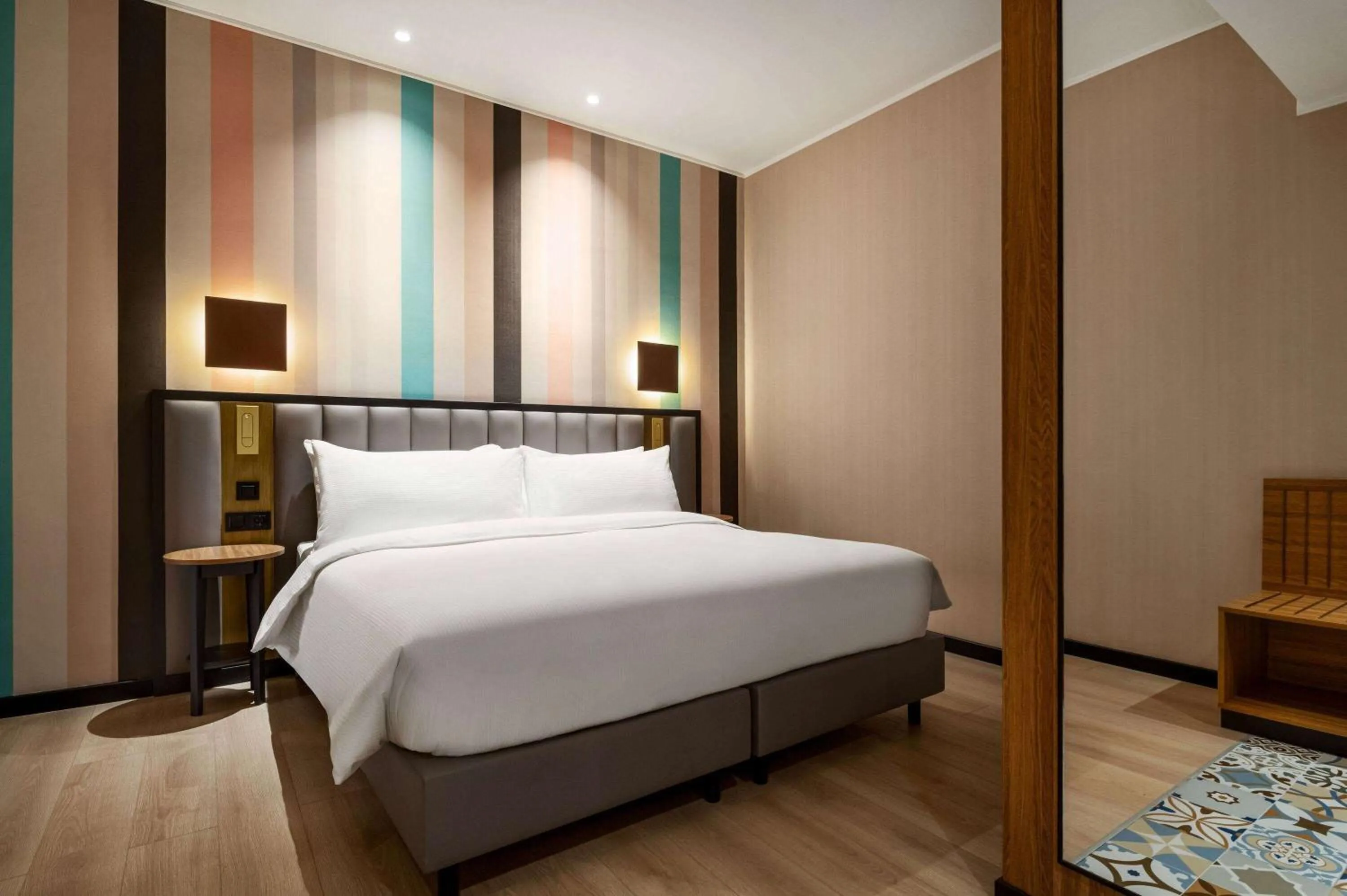 Bed in Ramada Encore by Wyndham Tashkent