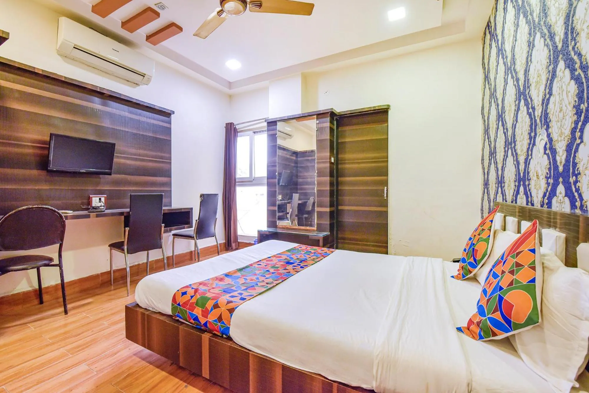 Bed in FabHotel Shri Shyam Palace