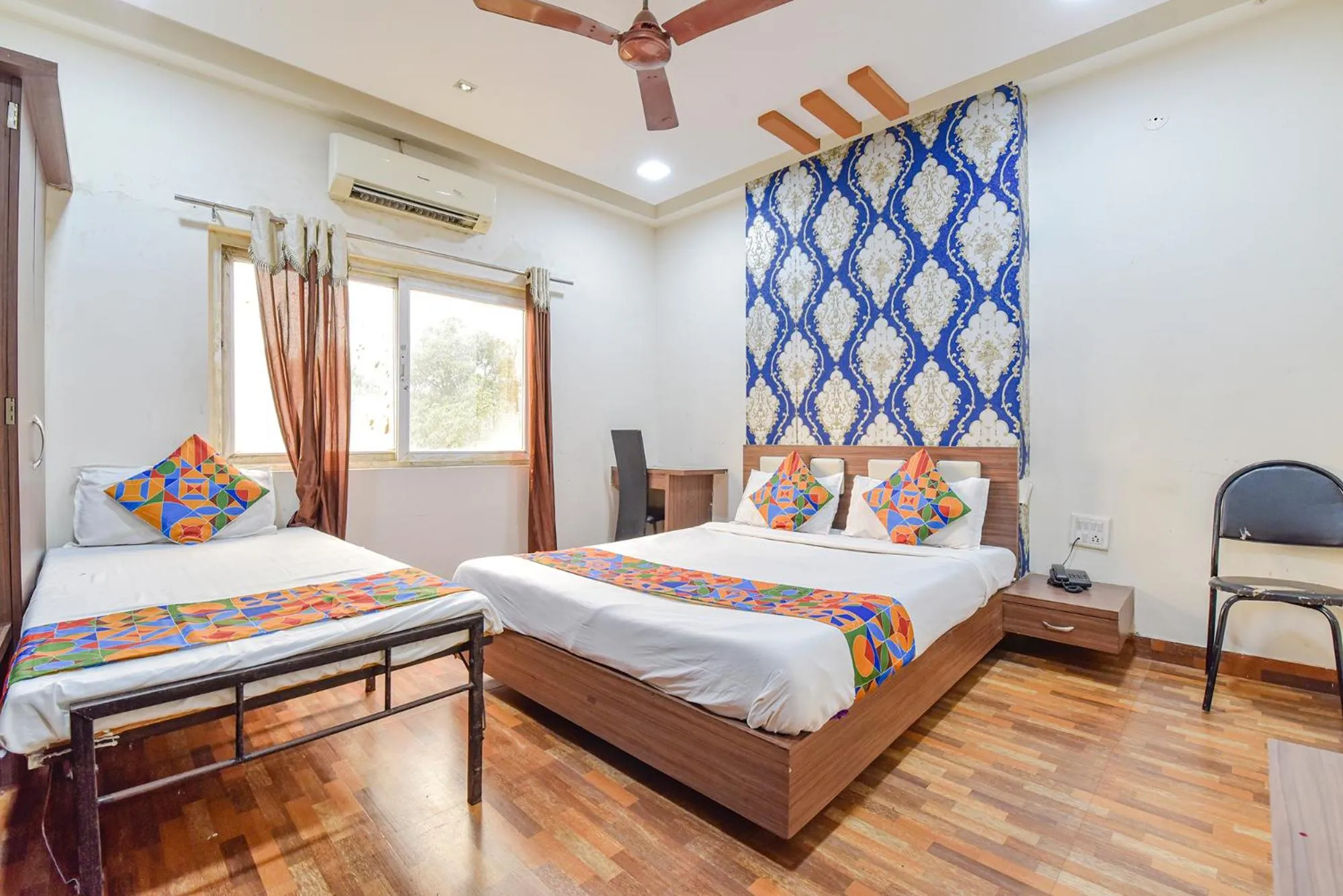 Bed in FabHotel Shri Shyam Palace