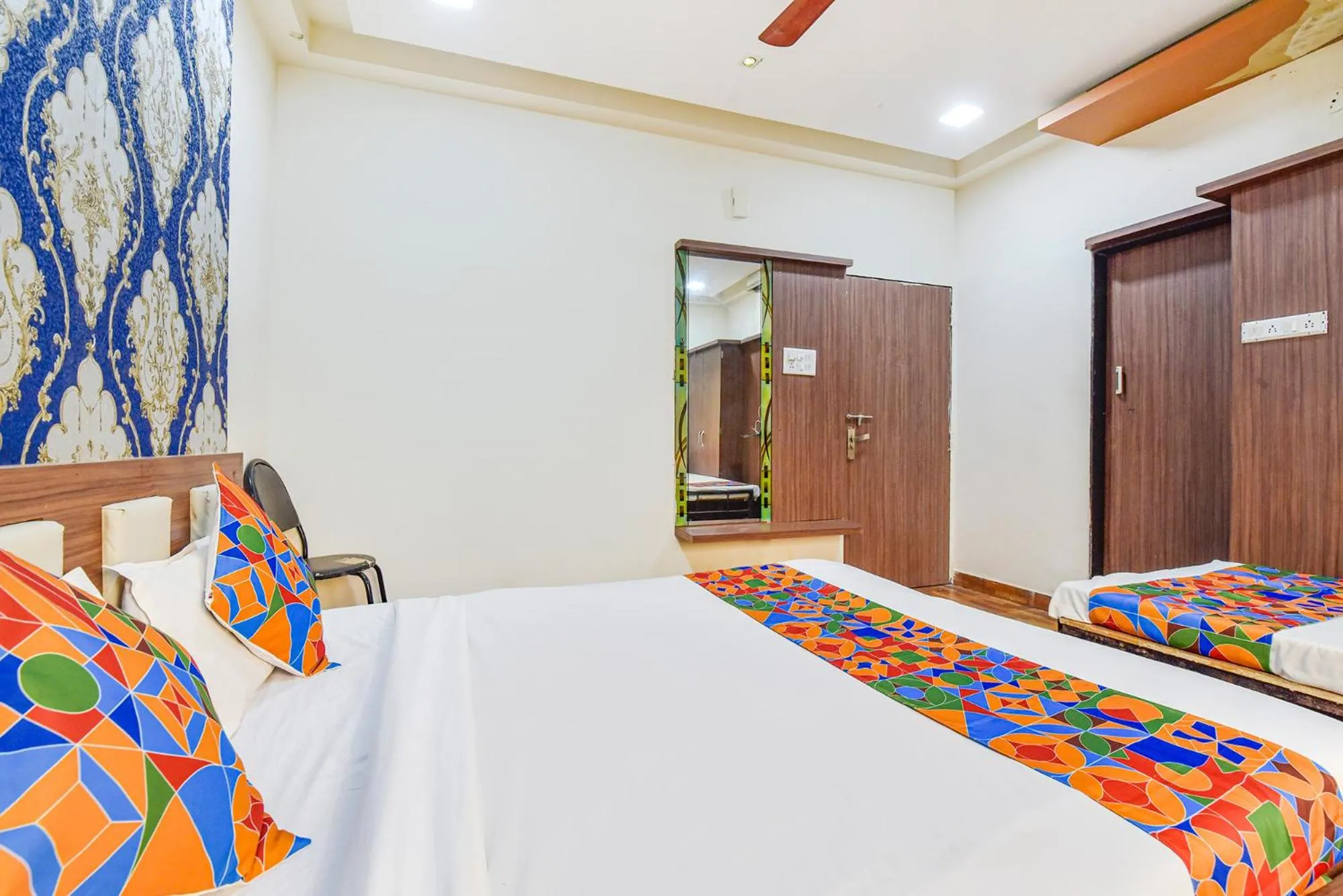 Bed in FabHotel Shri Shyam Palace