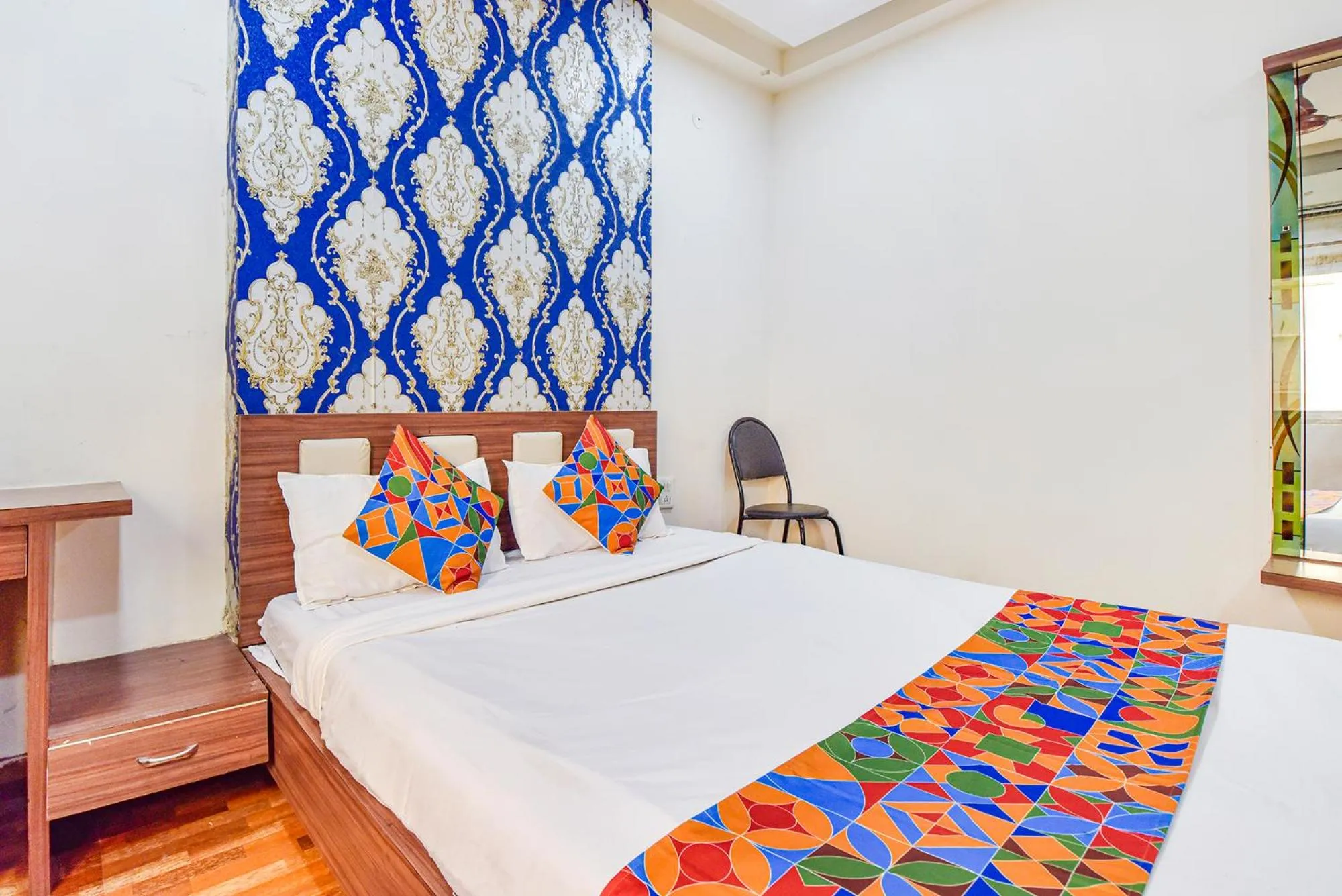 Bed in FabHotel Shri Shyam Palace