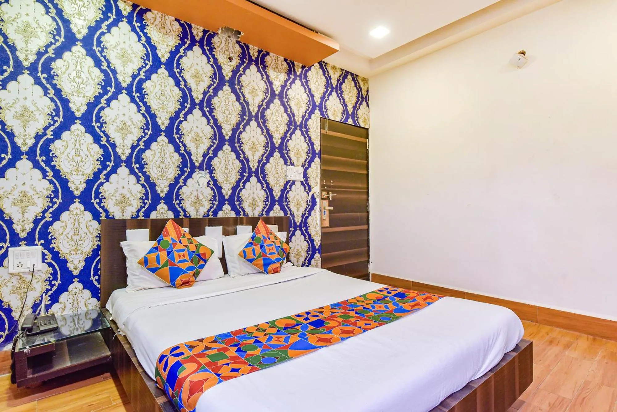 Bed in FabHotel Shri Shyam Palace
