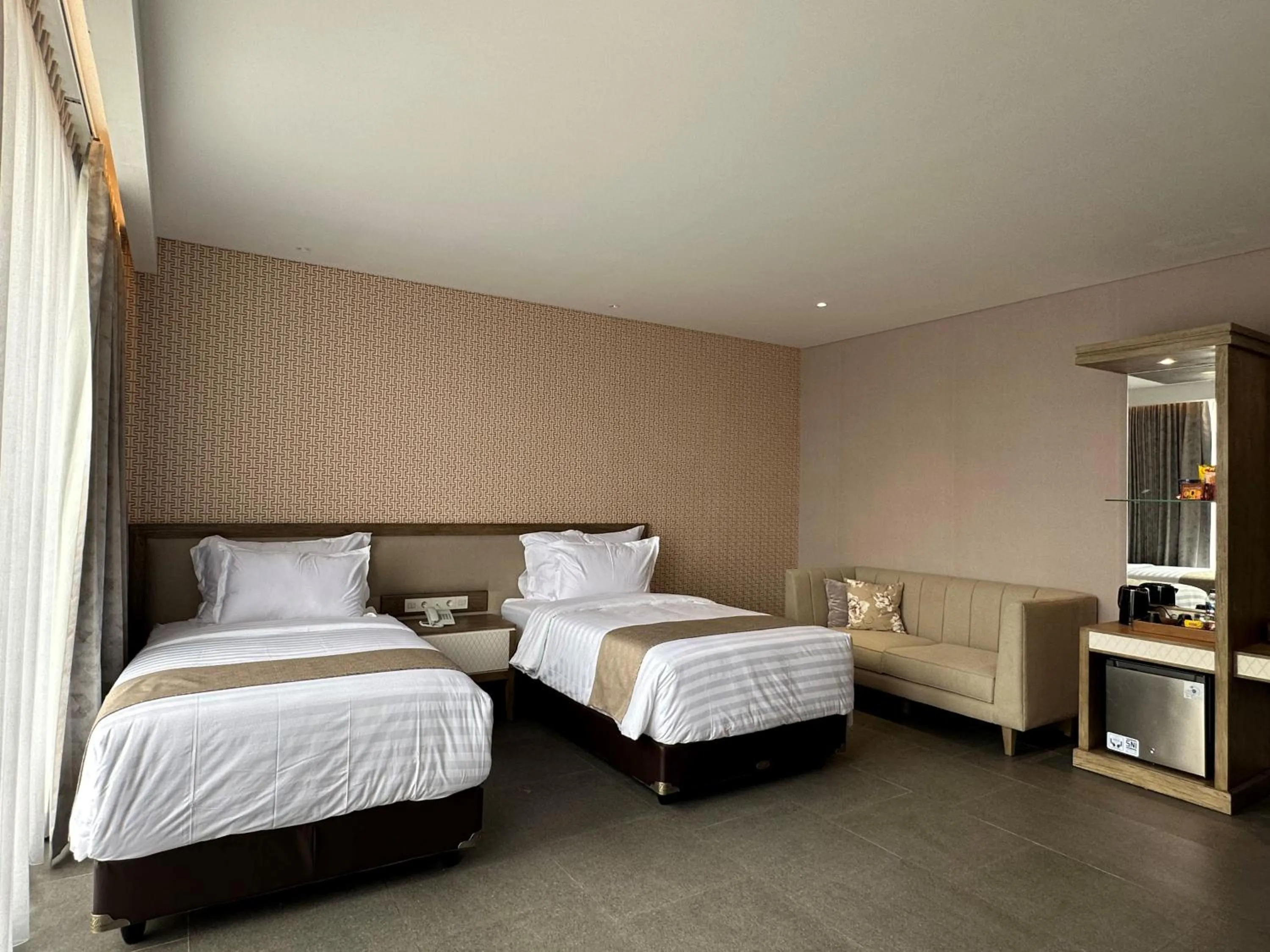 Bed in Tabebuya Resto & Resort