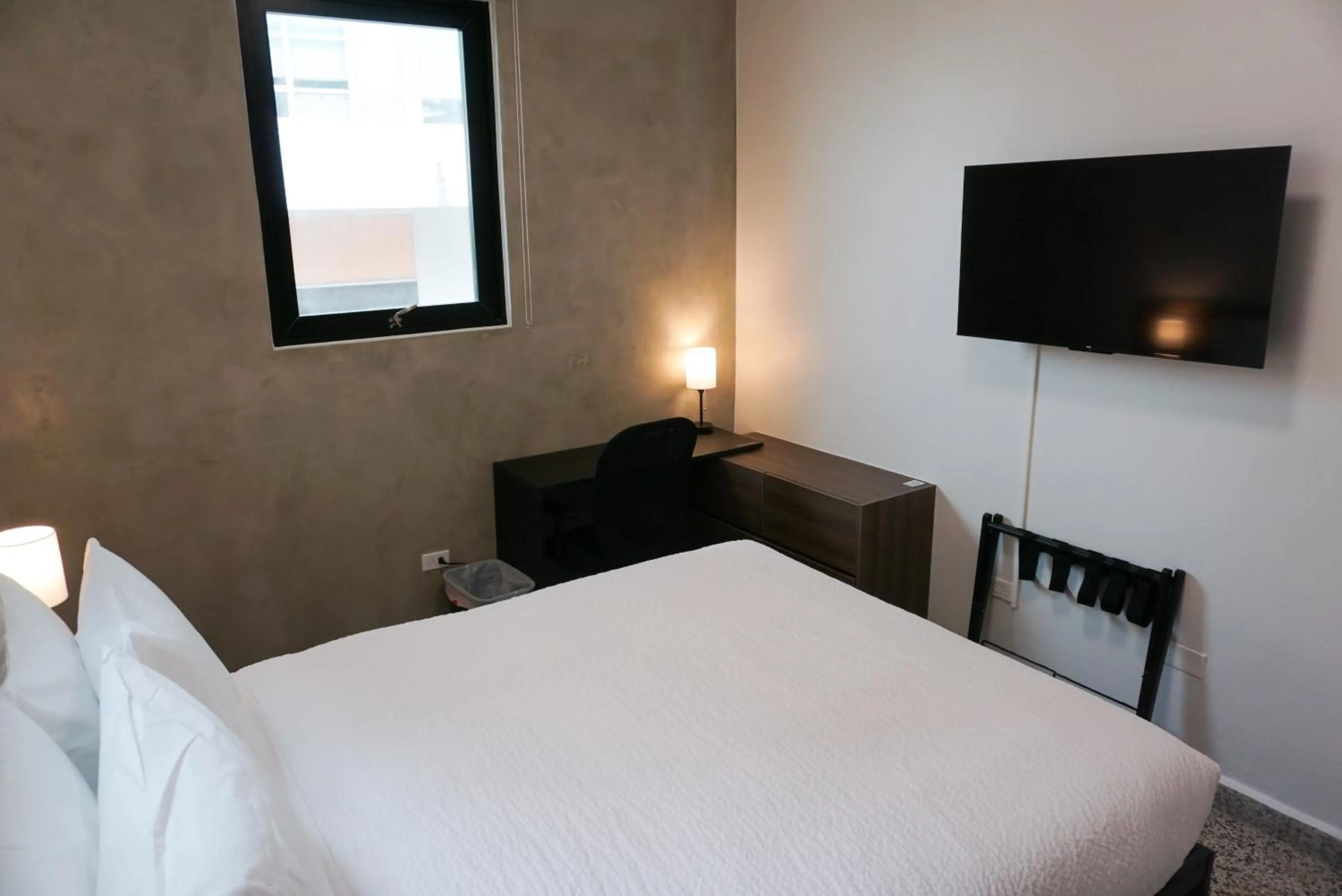 Photo of the whole room, Bed in The Looking Glass Hotel