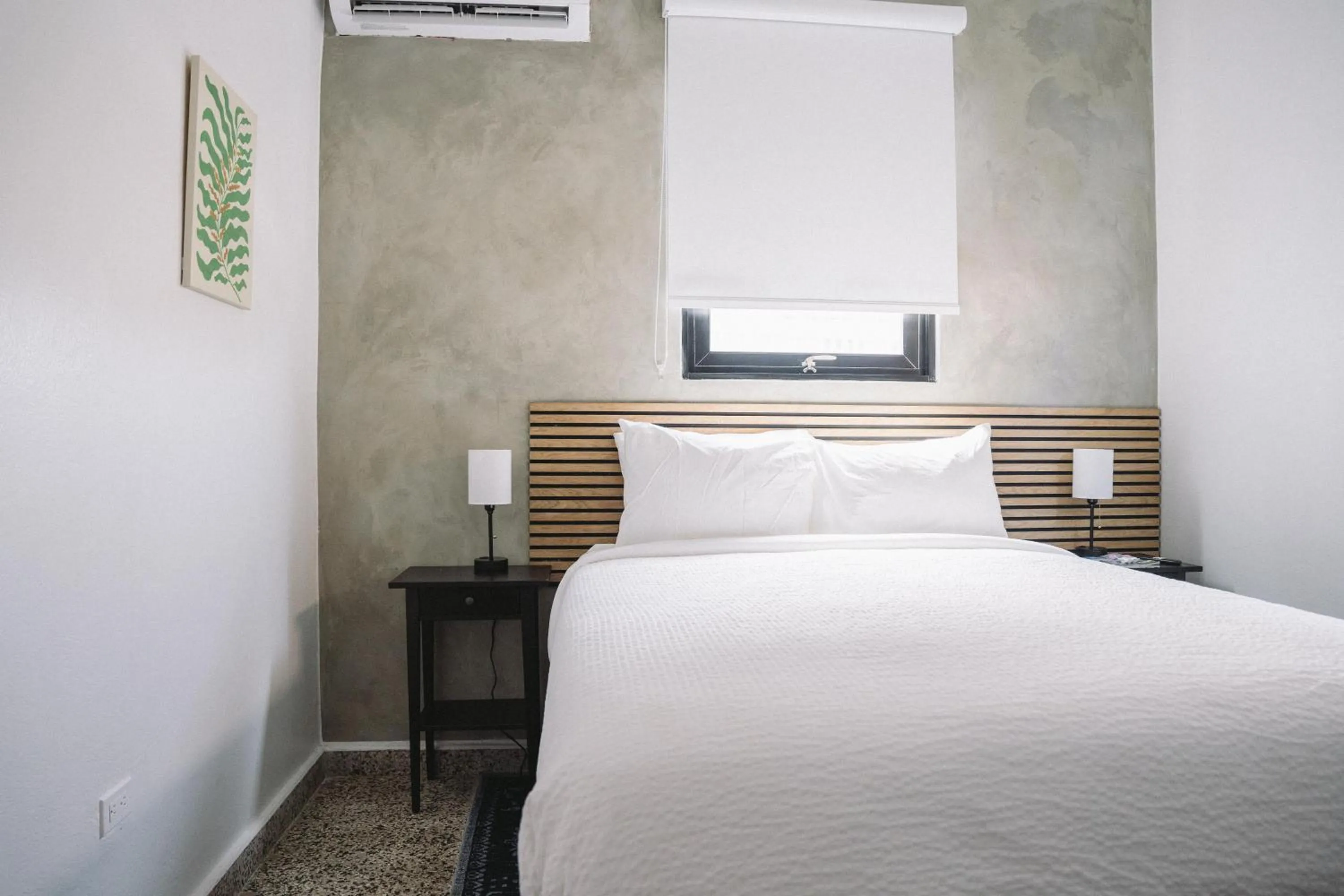 Bed in The Looking Glass Hotel