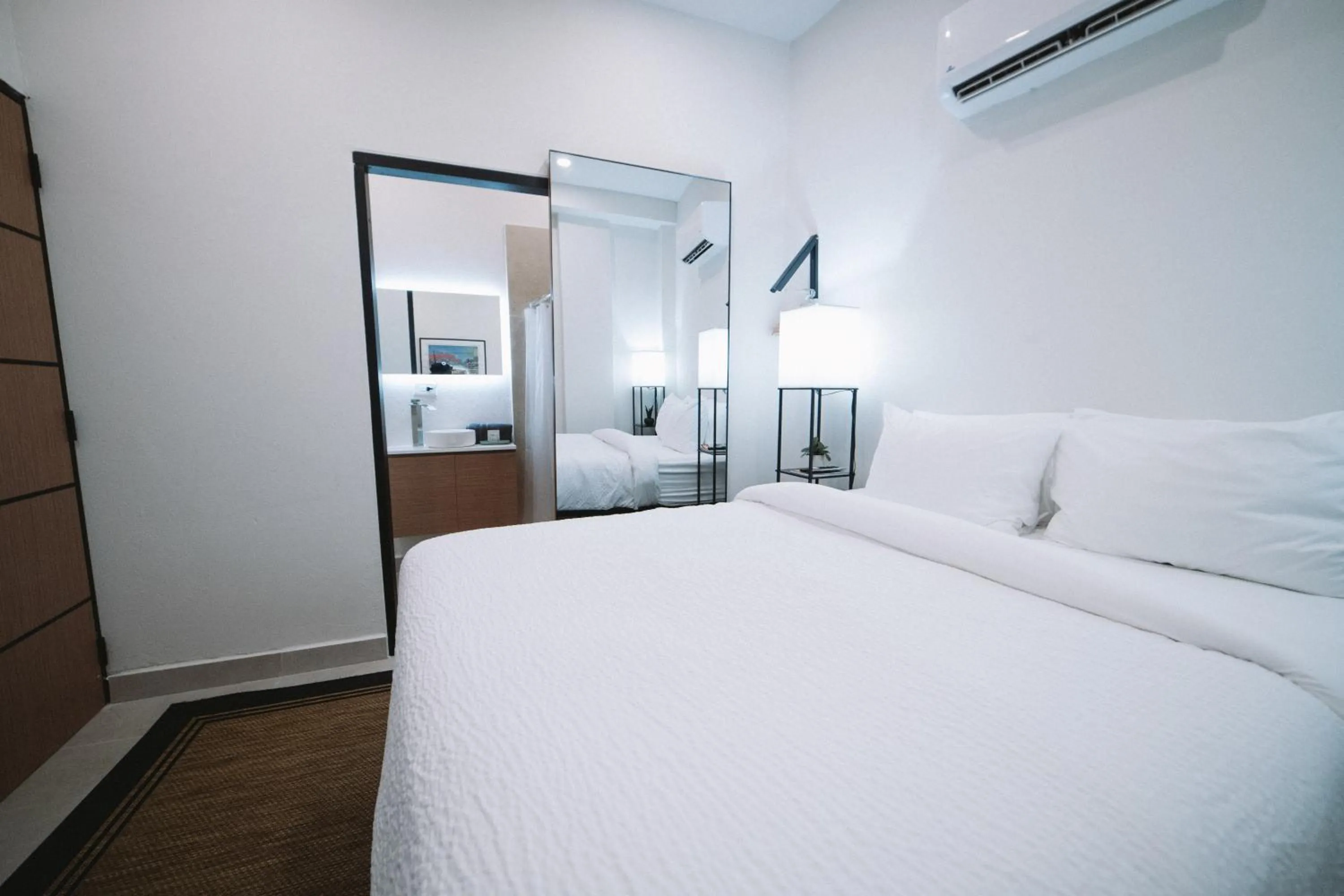 Bed in The Looking Glass Hotel