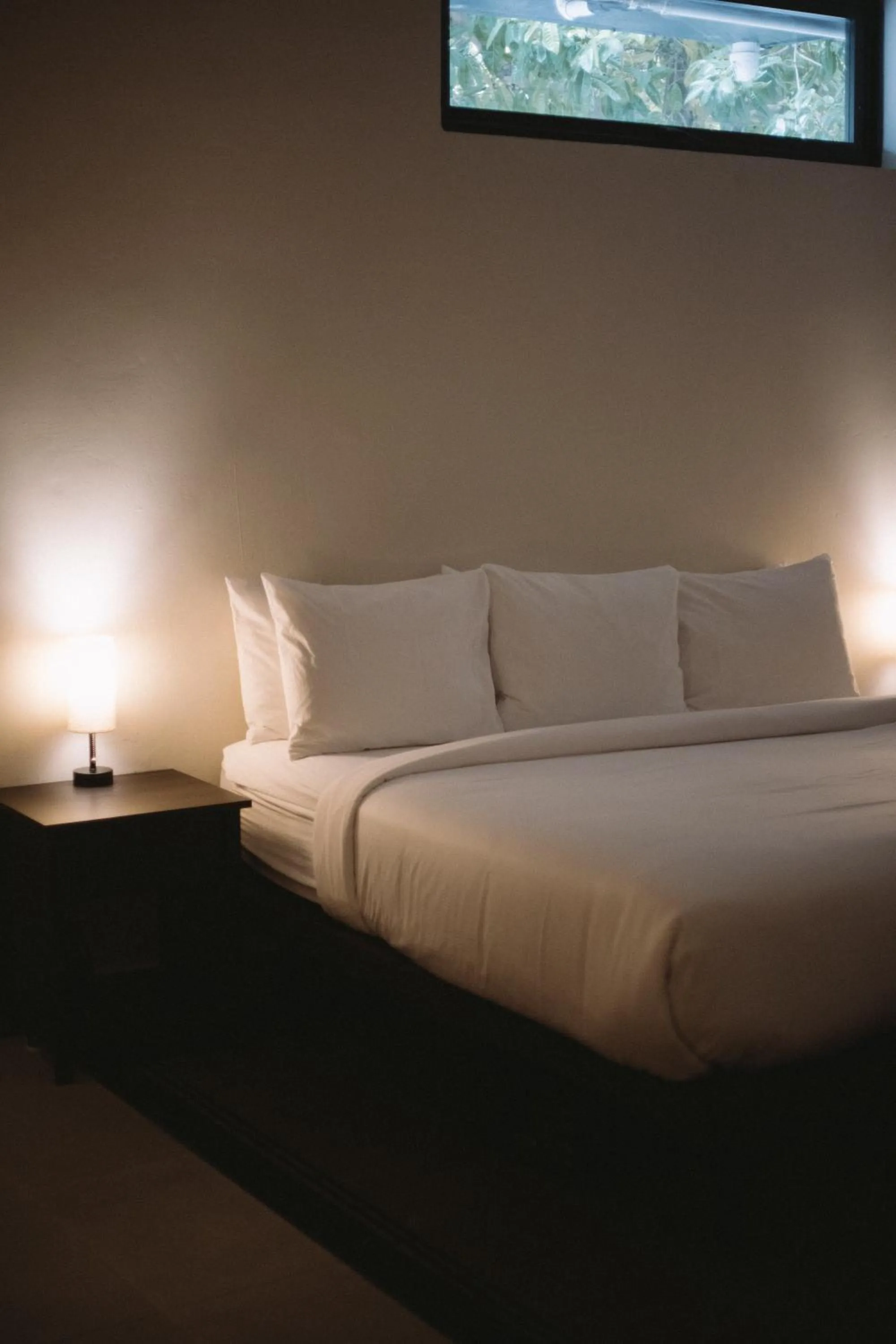 Bed in The Looking Glass Hotel