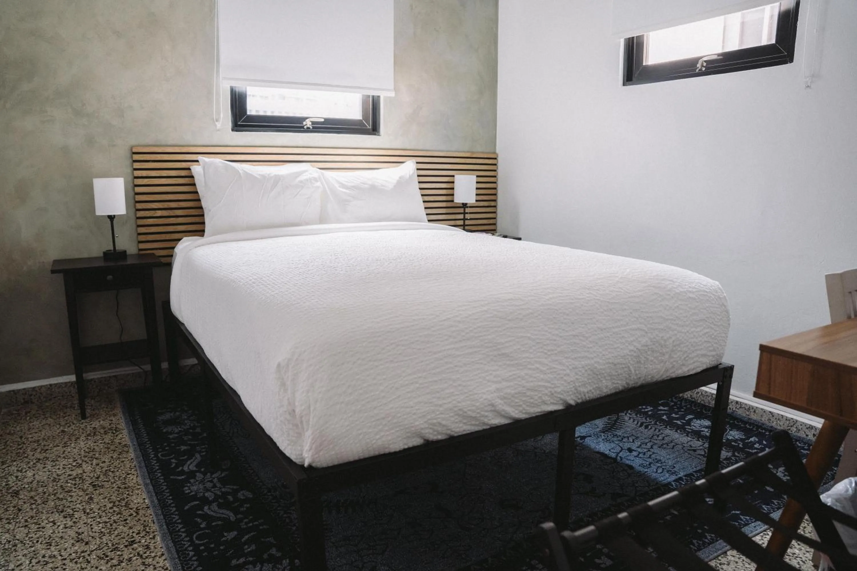 Bed in The Looking Glass Hotel