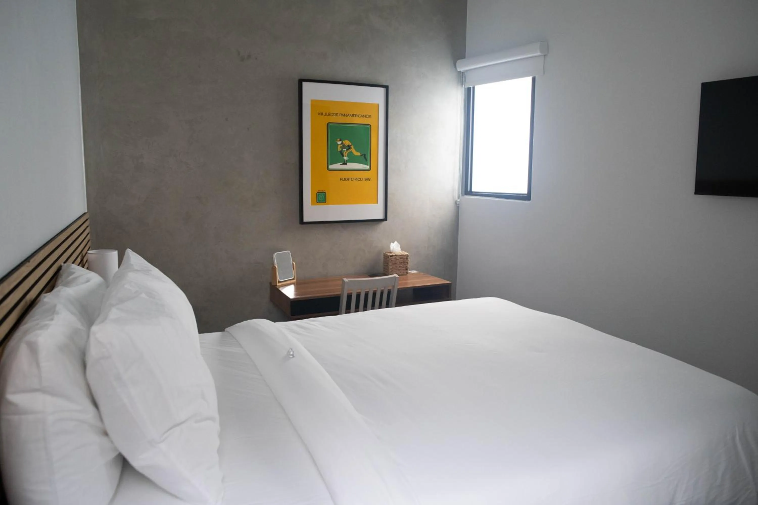 Bed in The Looking Glass Hotel