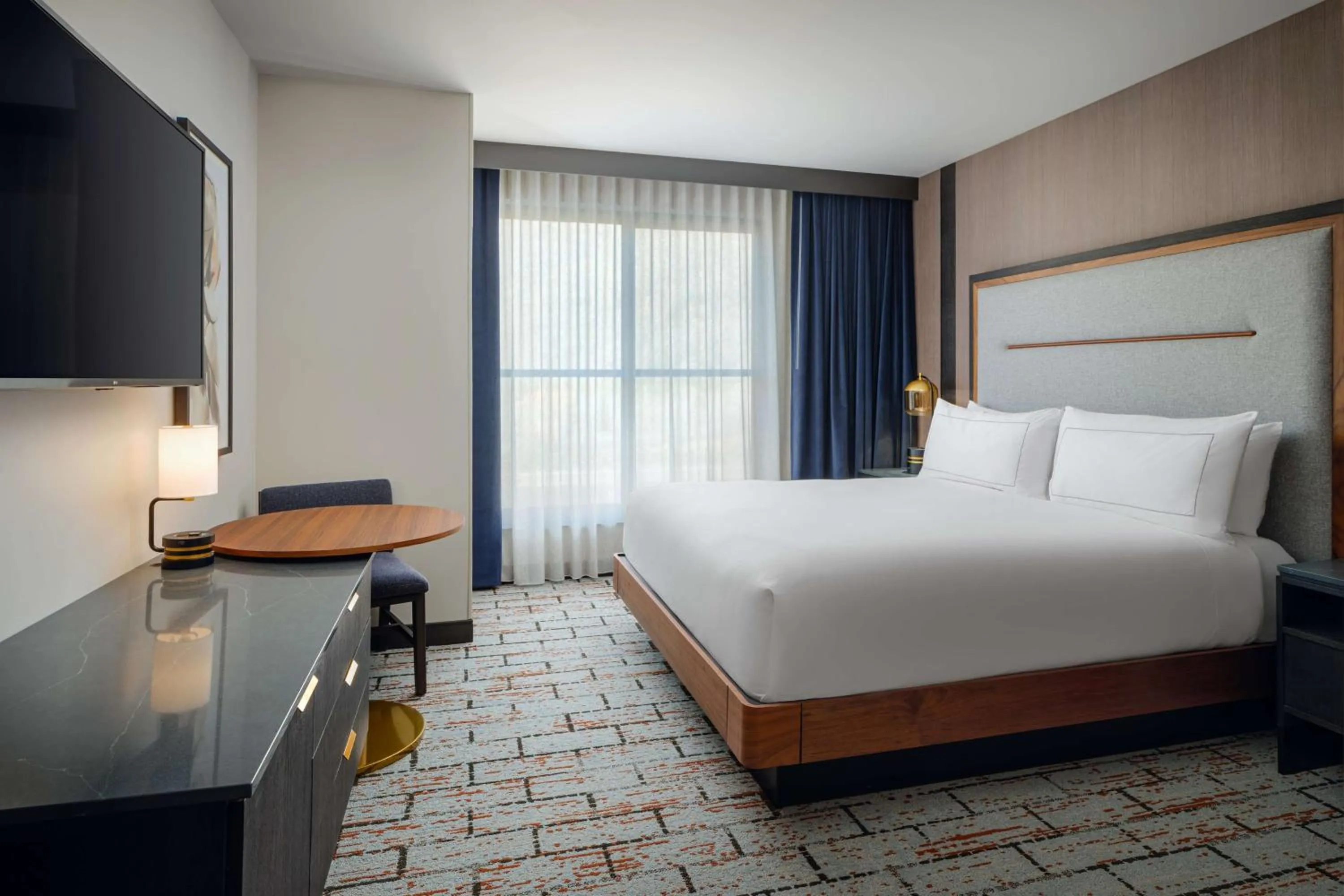 Bed in The Hoffmann Hotel Basalt Aspen Tapestry Collection Hilton