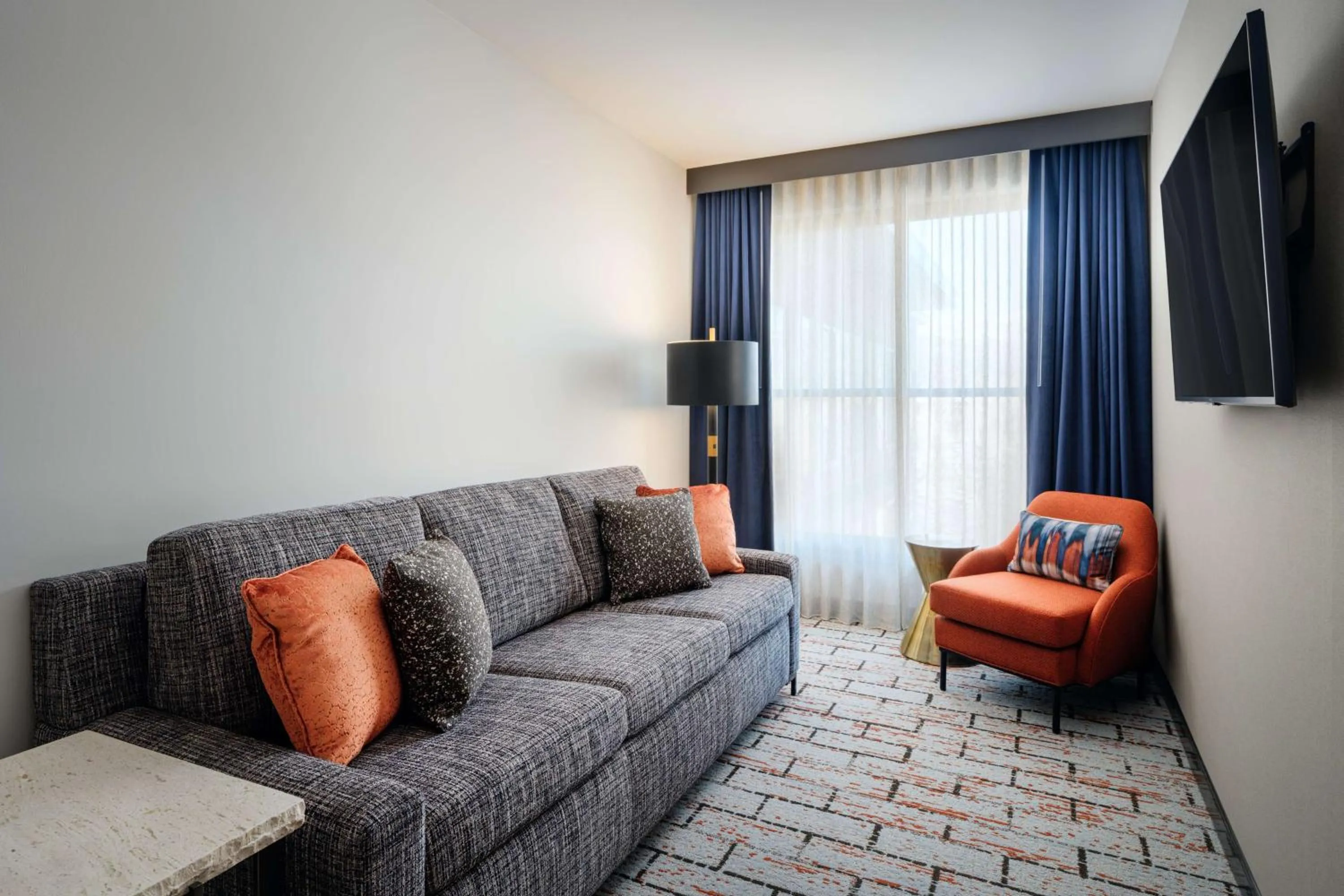 Living room in The Hoffmann Hotel Basalt Aspen Tapestry Collection Hilton