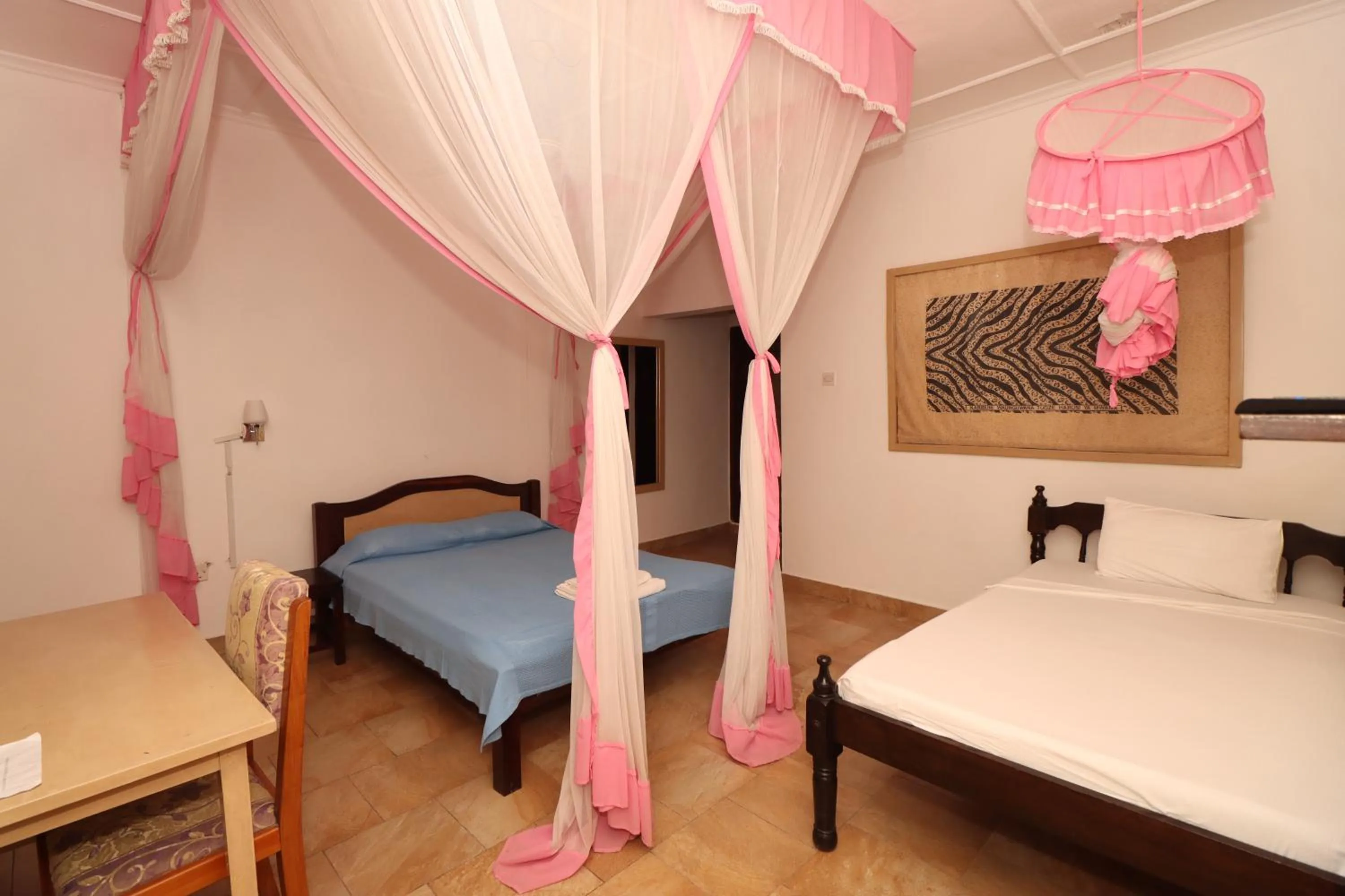 Bed in Makuti Villas Resort