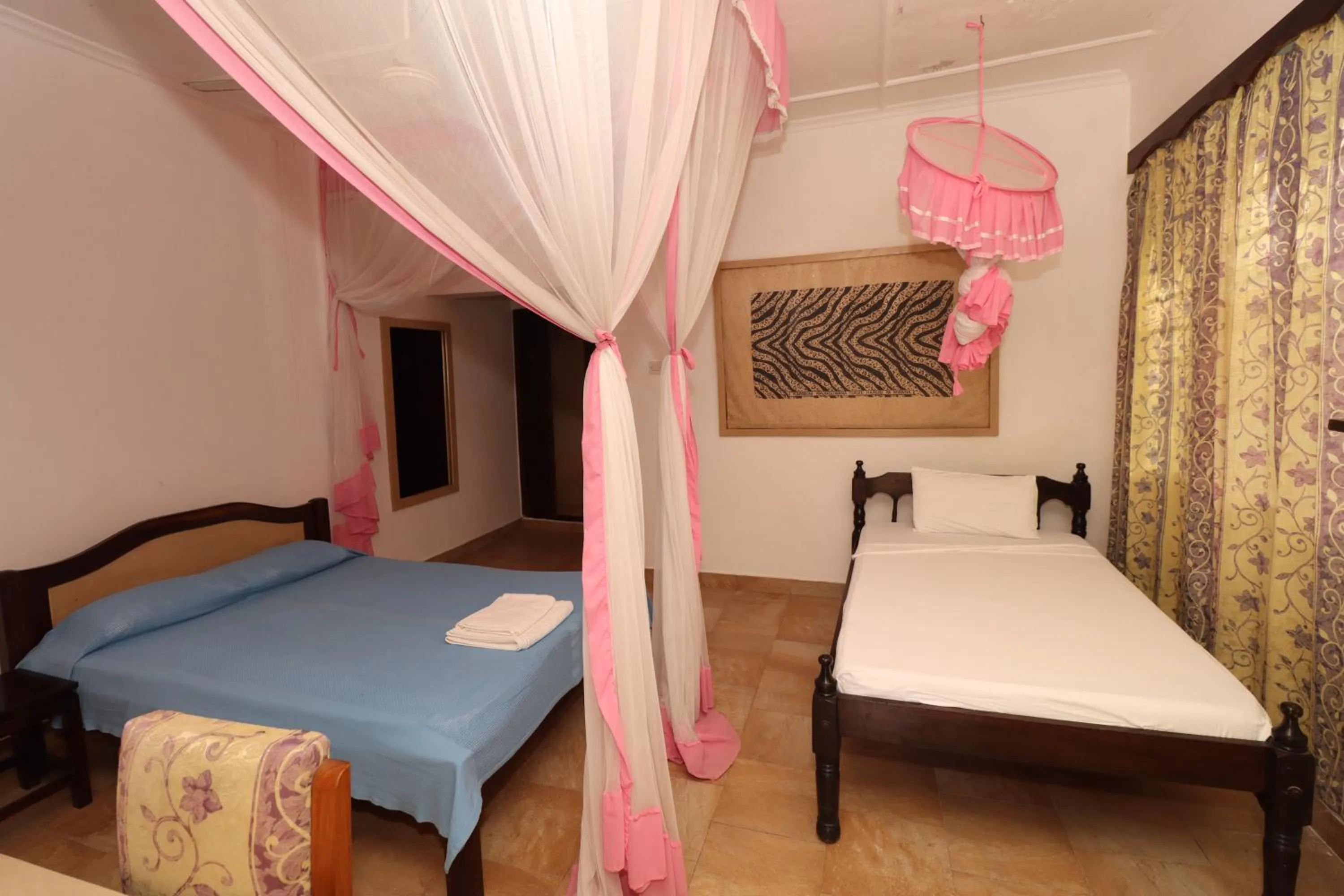 Bed in Makuti Villas Resort