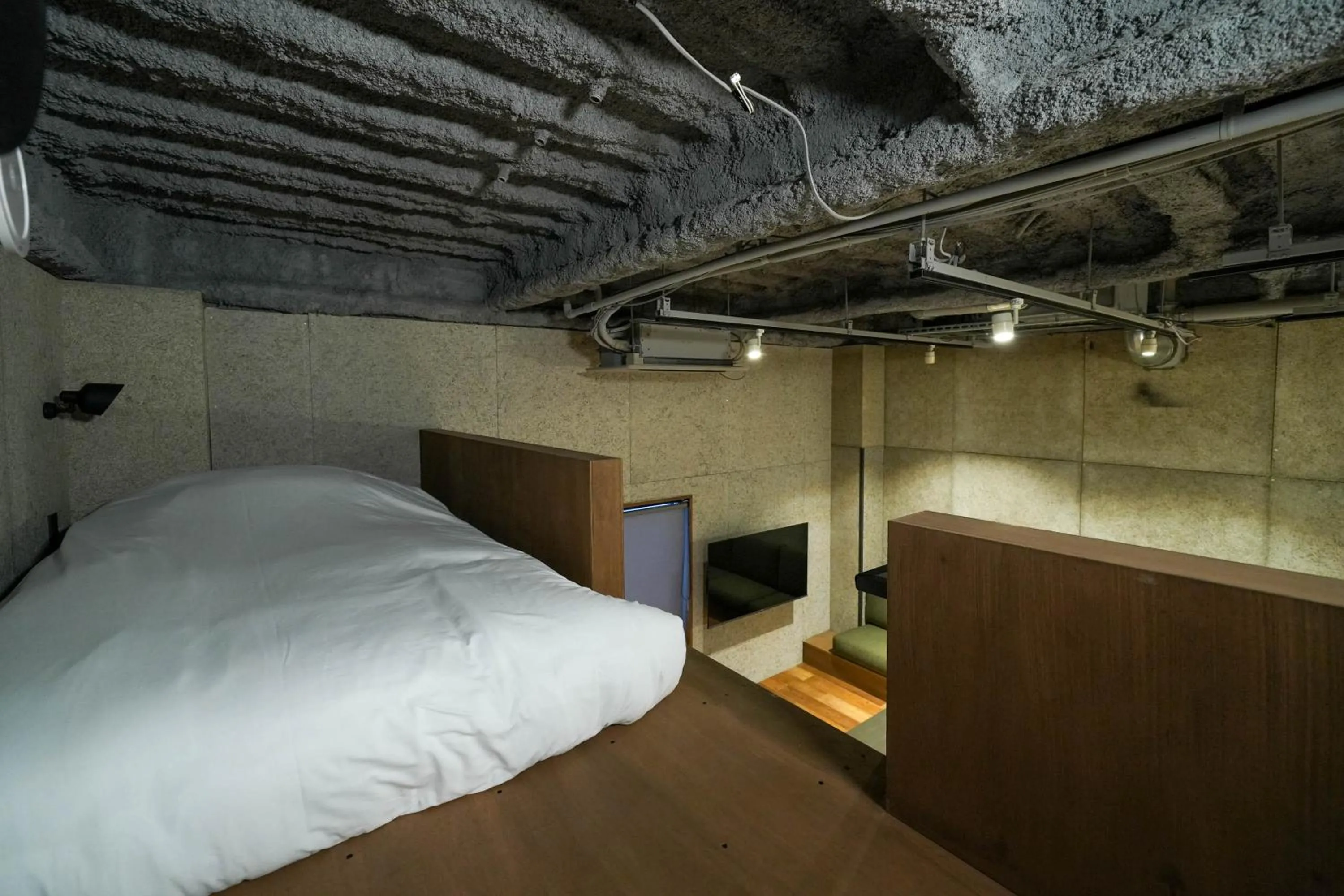 Bed in Green Room Hotel