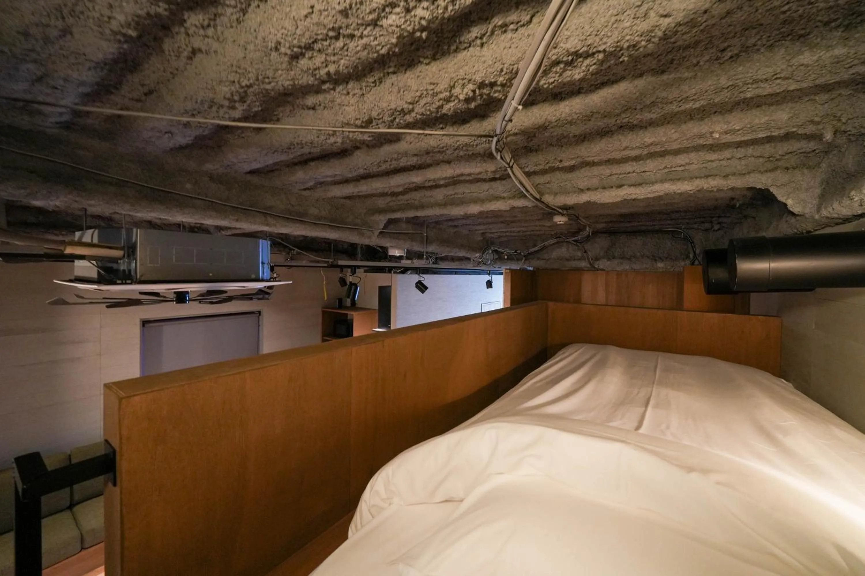 Bed in Green Room Hotel