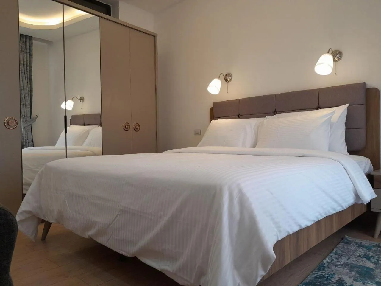 Bed in Zemilo Hotel Apartment