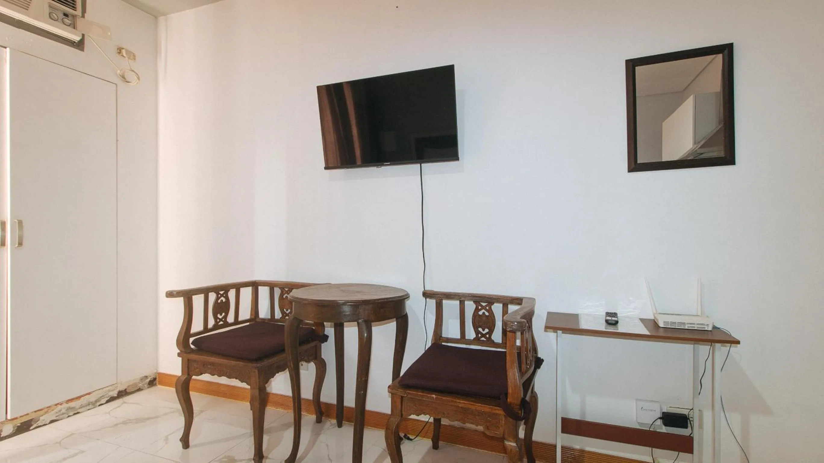 TV and multimedia in RedDoorz at TJMG by Bel Air Polaris Makati