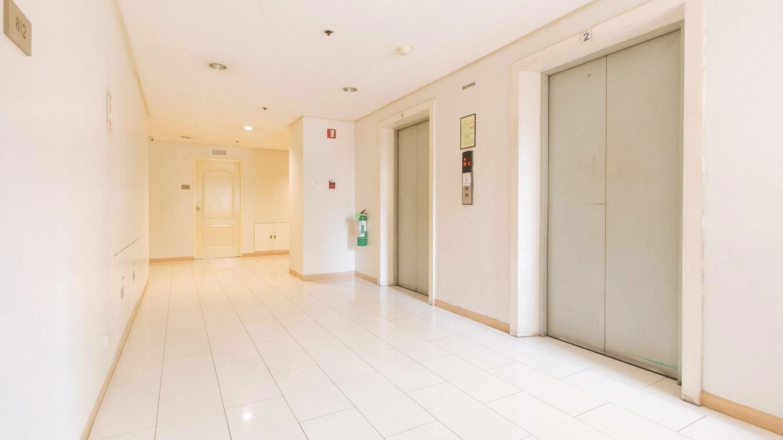 elevator in RedDoorz at TJMG by Bel Air Polaris Makati