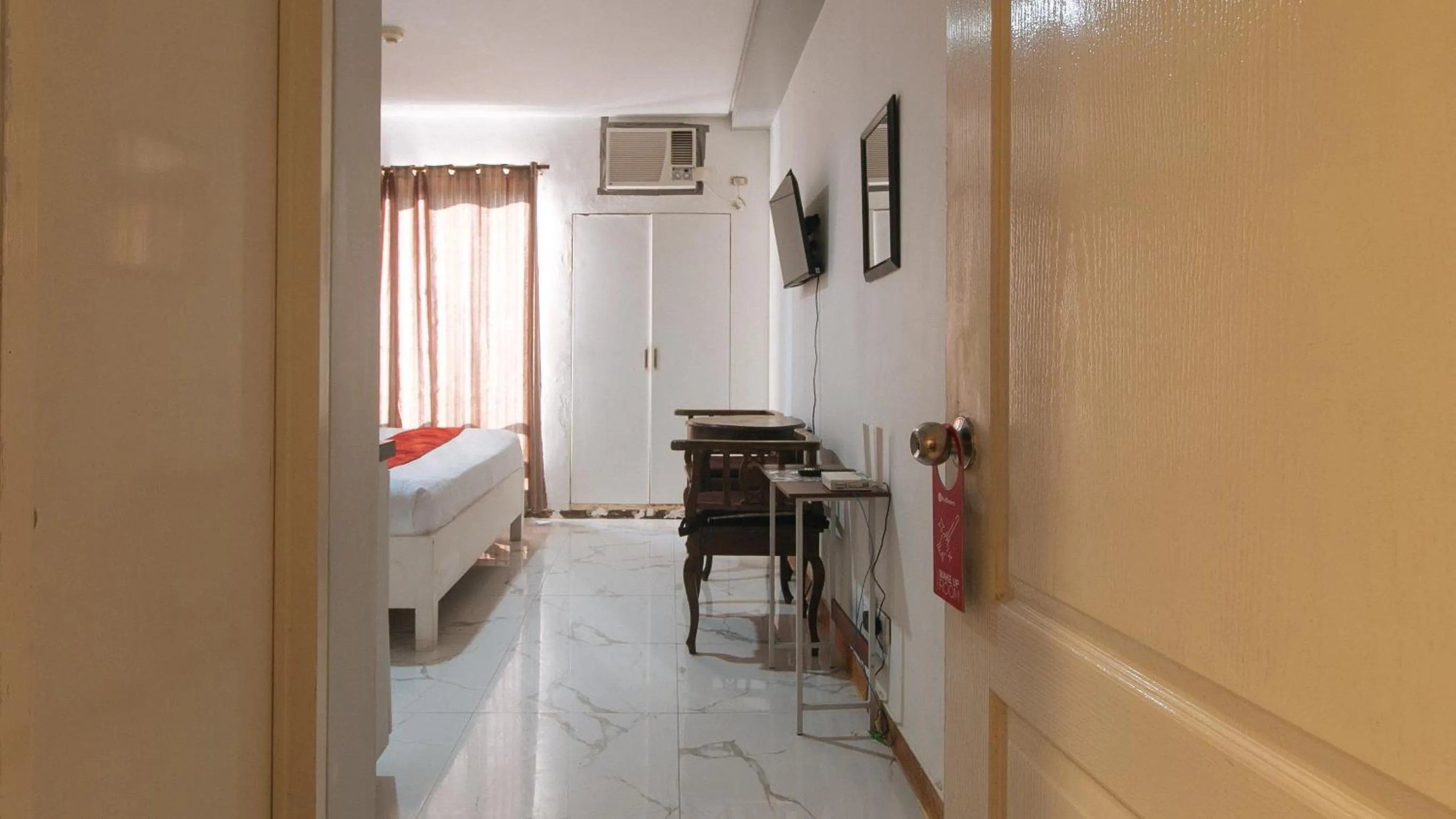 Bed in RedDoorz at TJMG by Bel Air Polaris Makati