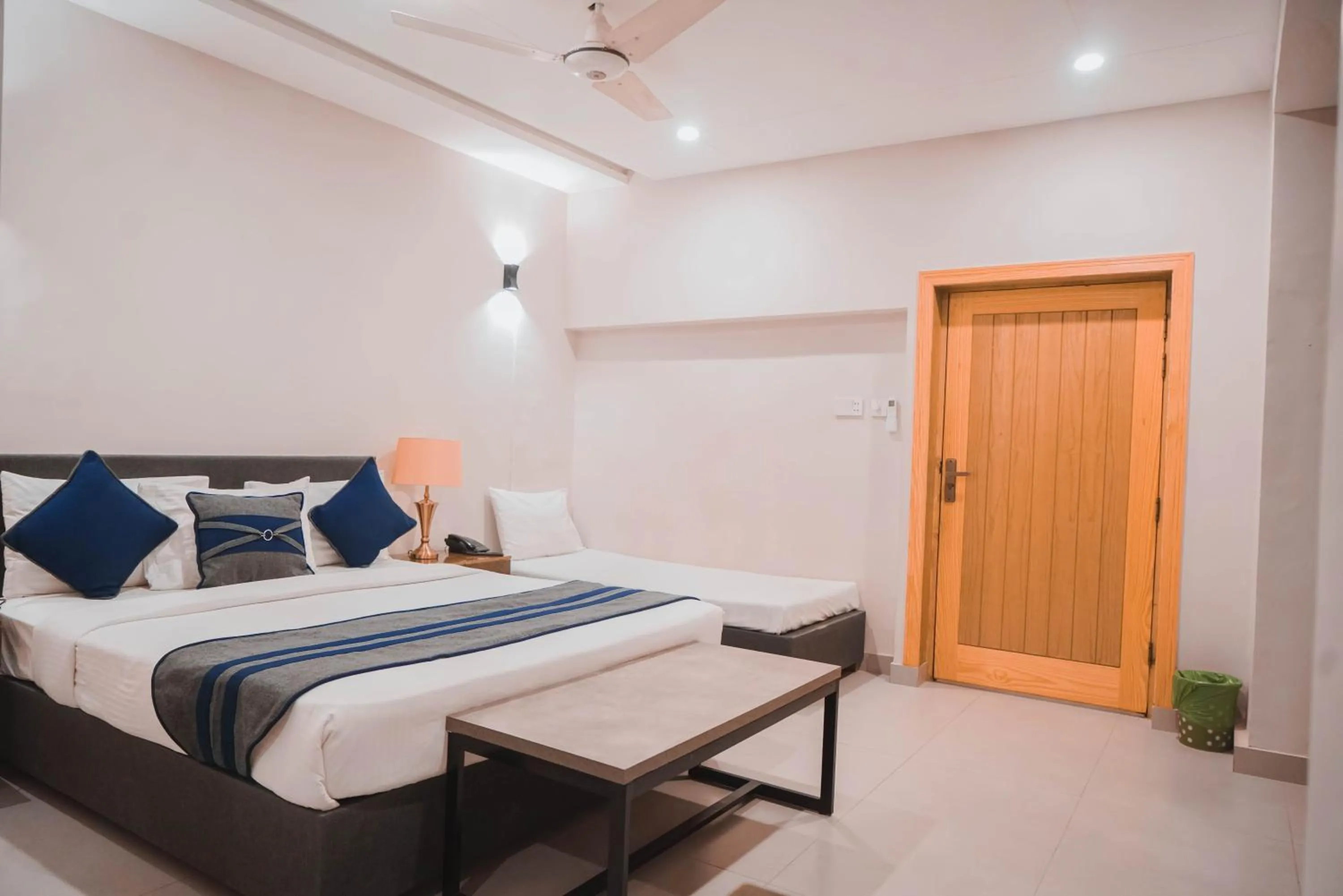 Bed in The Garden Hotel