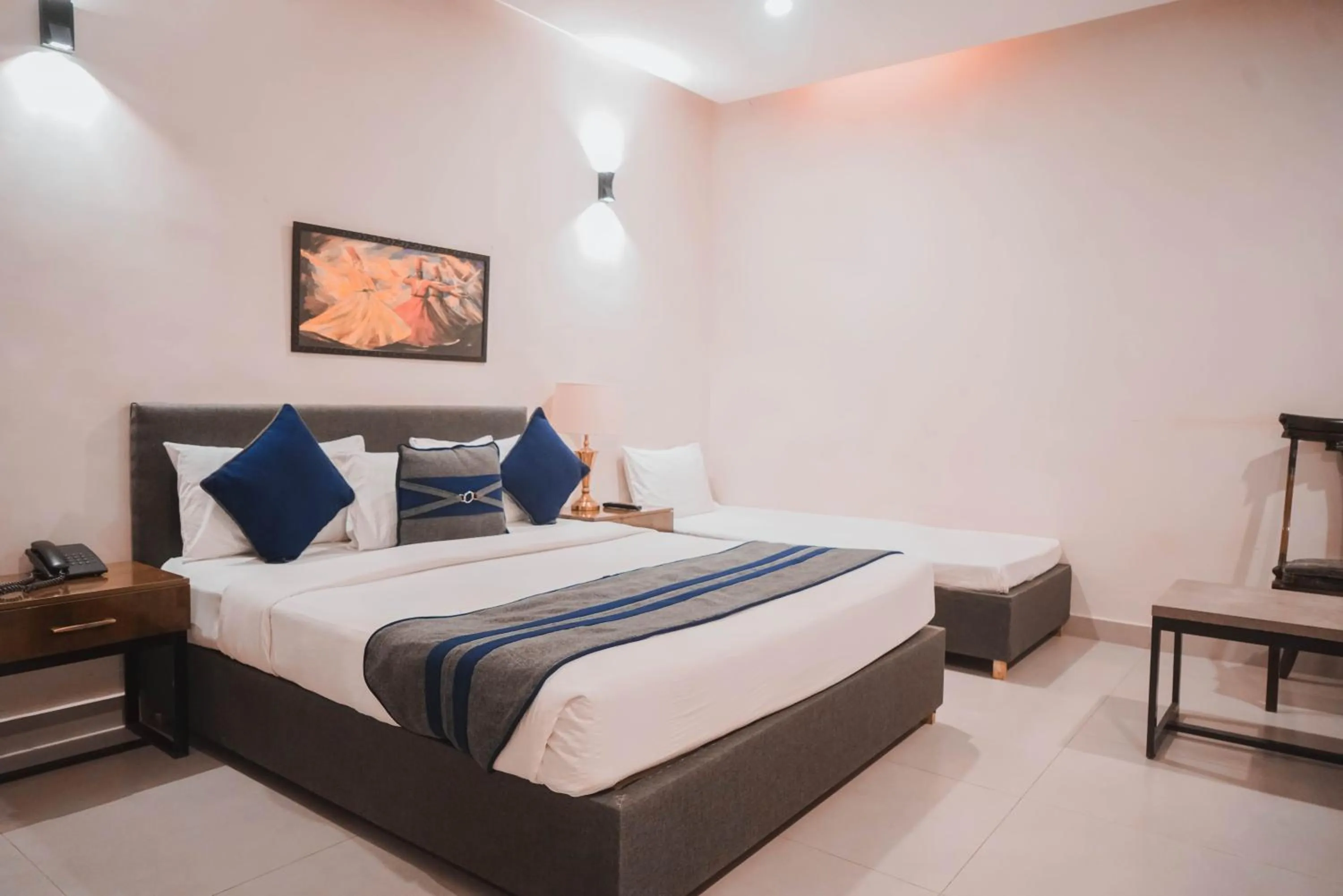 Bed in The Garden Hotel