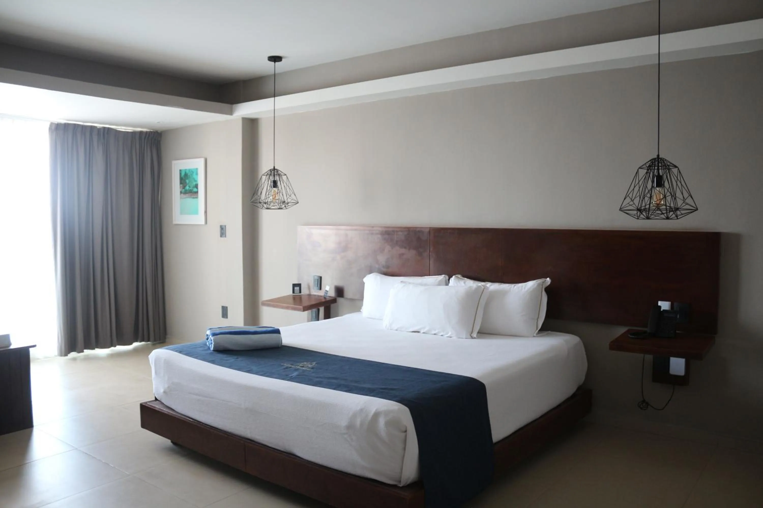 Bed in Ocean Dream Cancun by GuruHotel