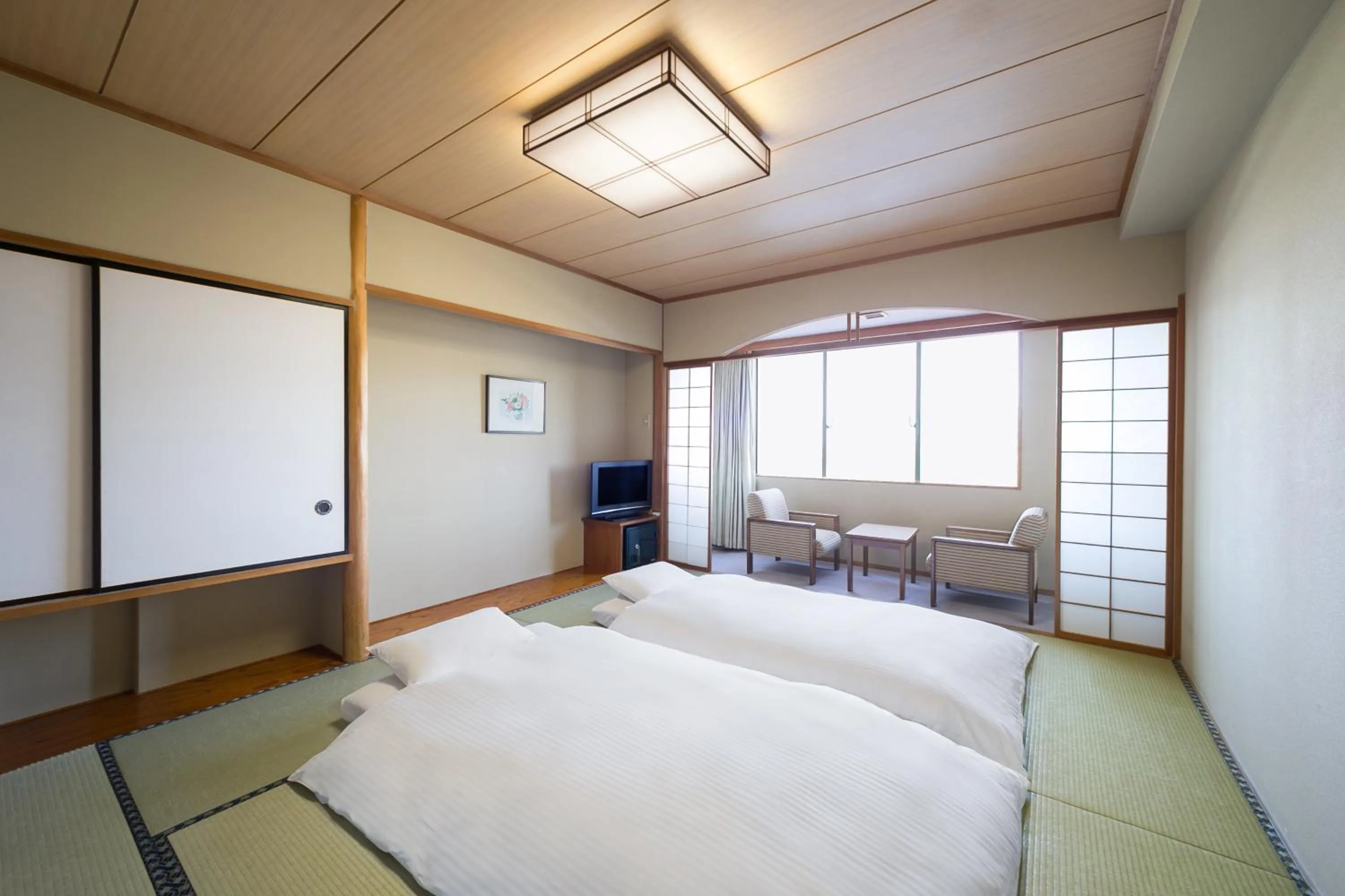 Photo of the whole room, Bed in Grand Mercure Beppu Bay Resort & Spa