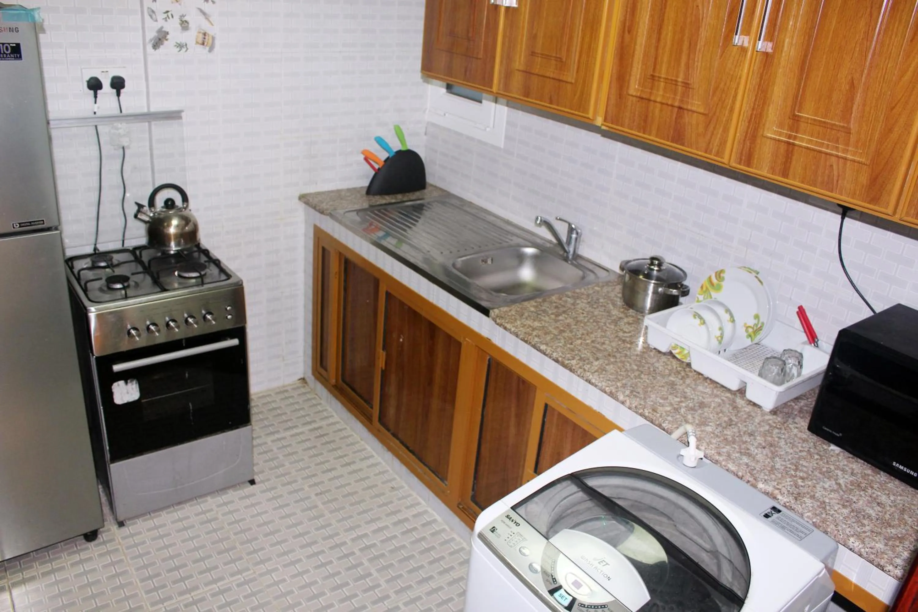Kitchen or kitchenette in Al Noor Furnished Flats