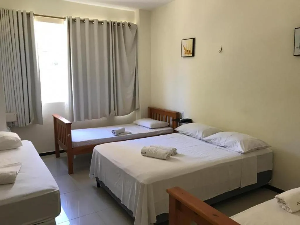 Bed in Alfinin Hotel de Praia