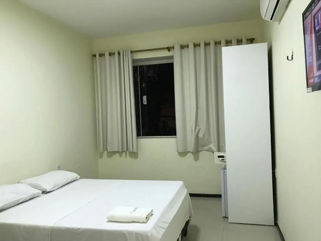 Bed in Alfinin Hotel de Praia