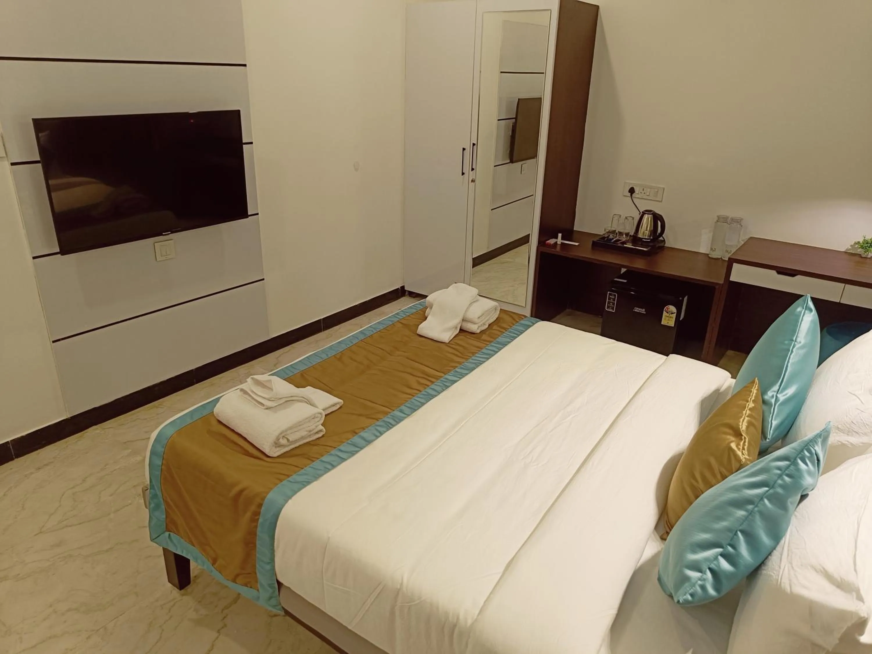 Bed in Bay Breeze Suites